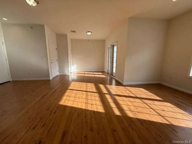 Unfurnished room with recessed lighting and wood finished floors Unfurnished room with recessed lighting and wood finished floors