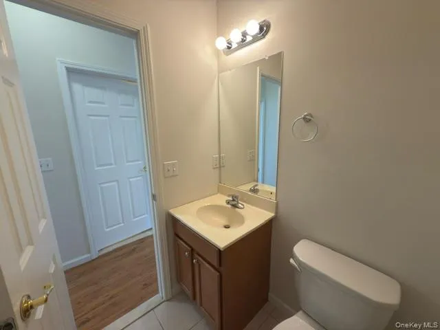 Bathroom with vanity and light tile patterned flooring Bathroom with vanity and light tile patterned flooring