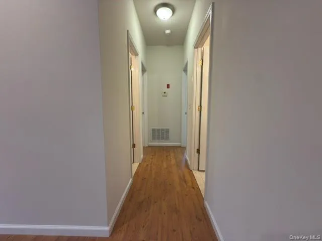 Hallway with 1 full bath, Half Bath & two bedrooms Hallway with 1 full bath, Half Bath & two bedrooms