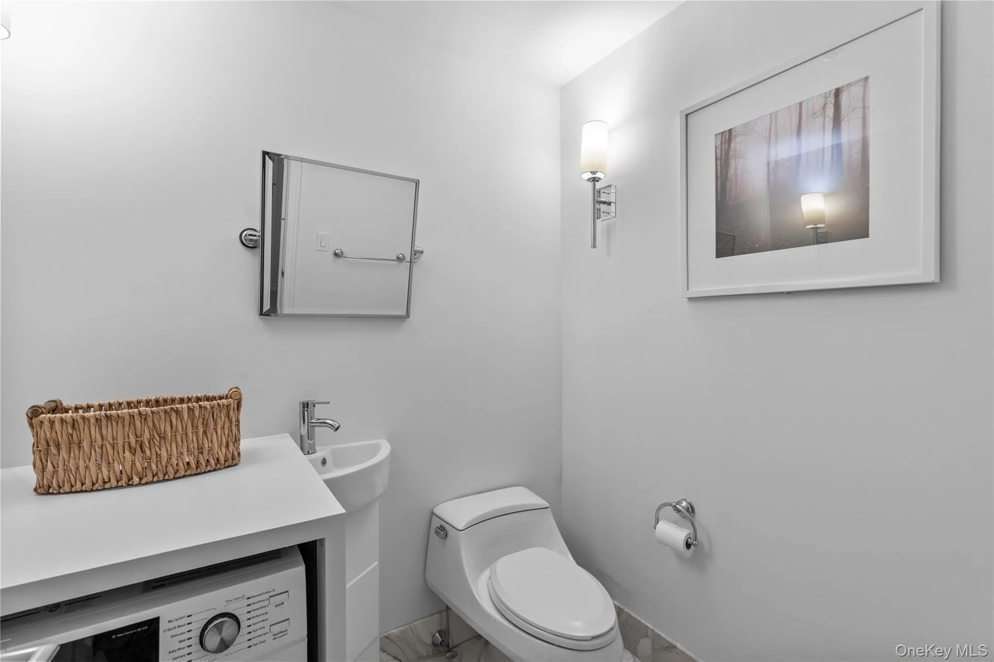 Bathroom with washer / dryer and toilet Bathroom with washer / dryer and toilet