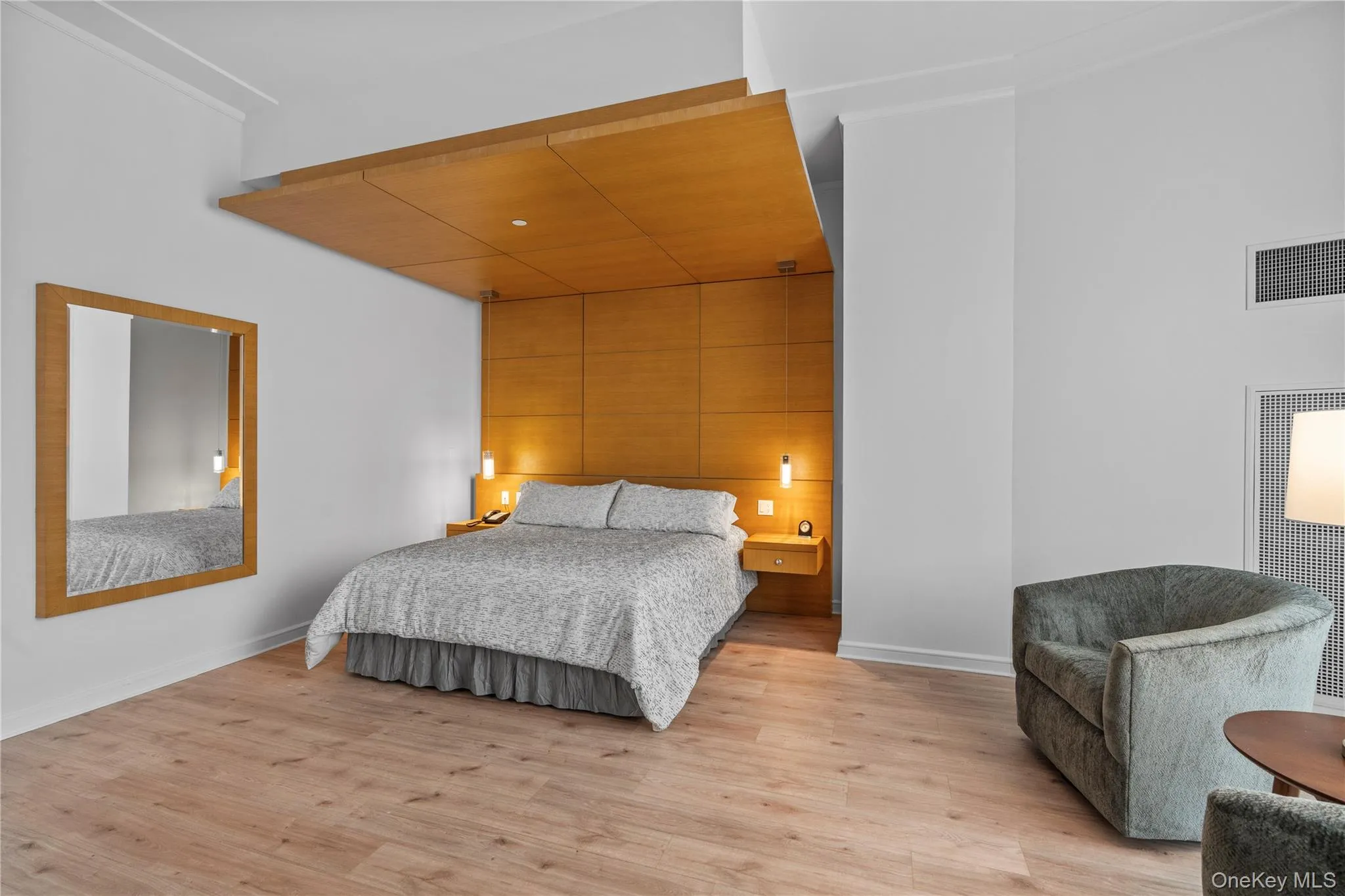 Bedroom featuring baseboards, visible vents, and light wood-style floors Bedroom featuring baseboards, visible vents, and light wood-style floors