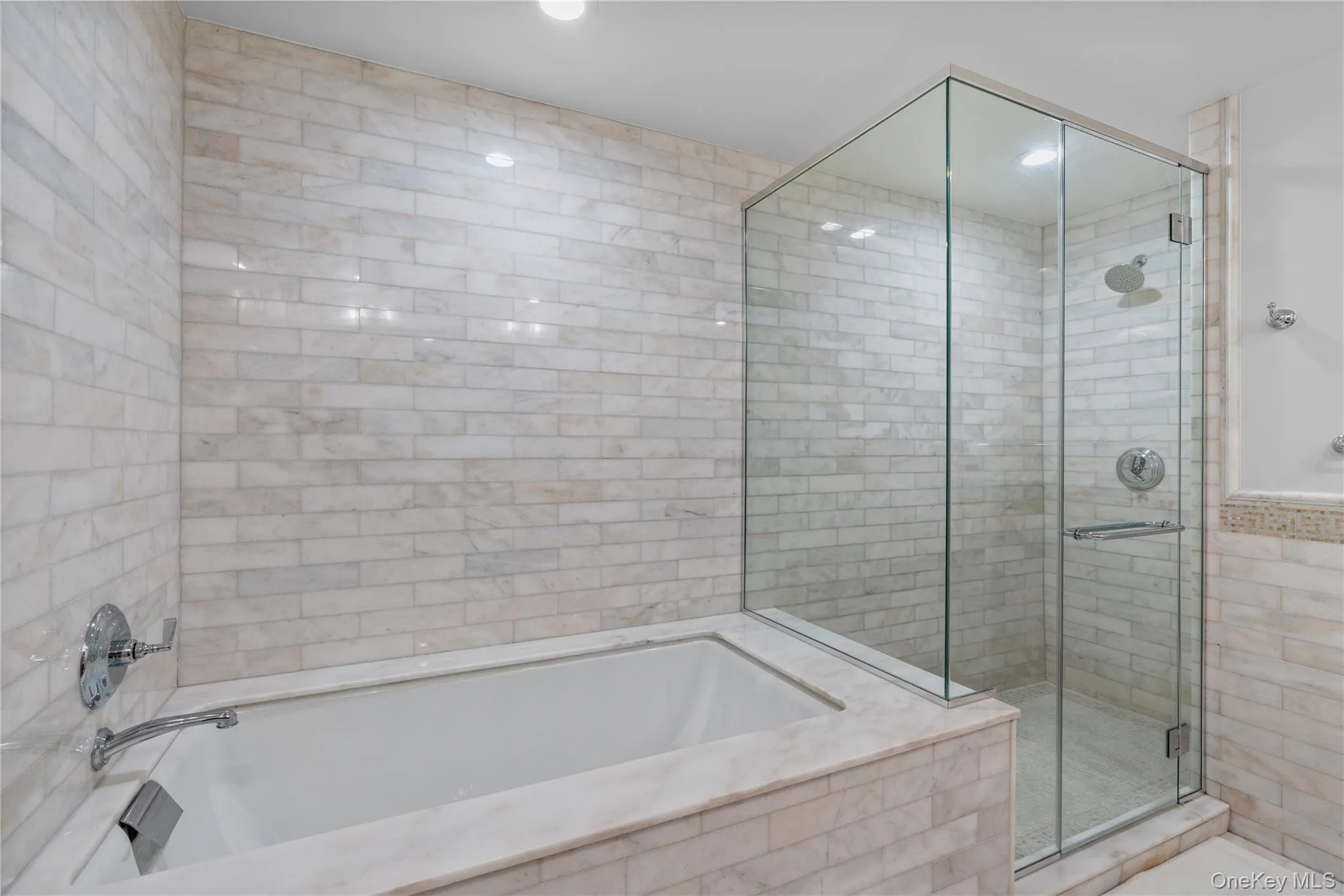 Full bathroom featuring a shower stall and a bath Full bathroom featuring a shower stall and a bath