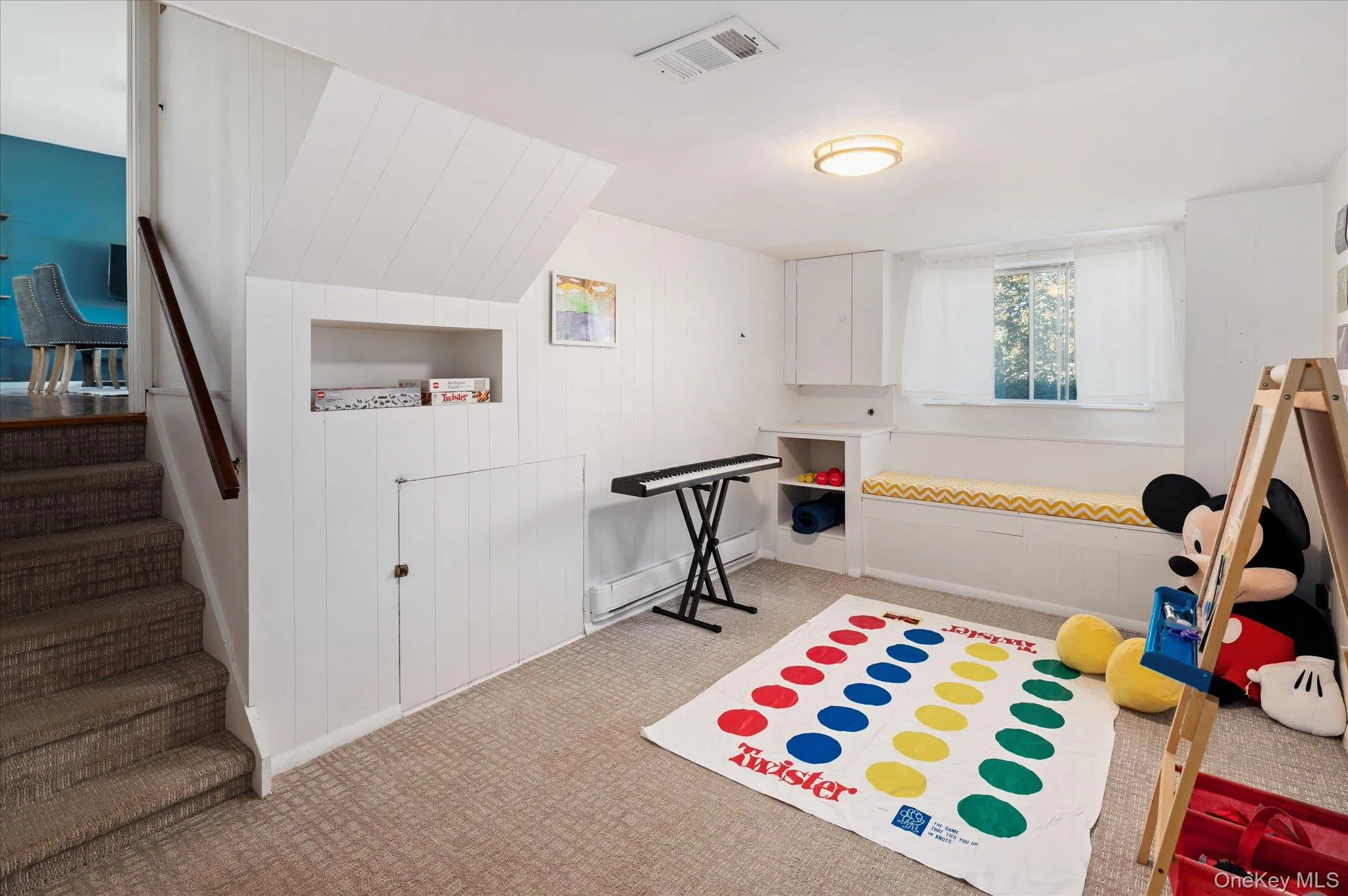 Lower level recreation space, door to large crawl/storage space. Lower level recreation space, door to large crawl/storage space.