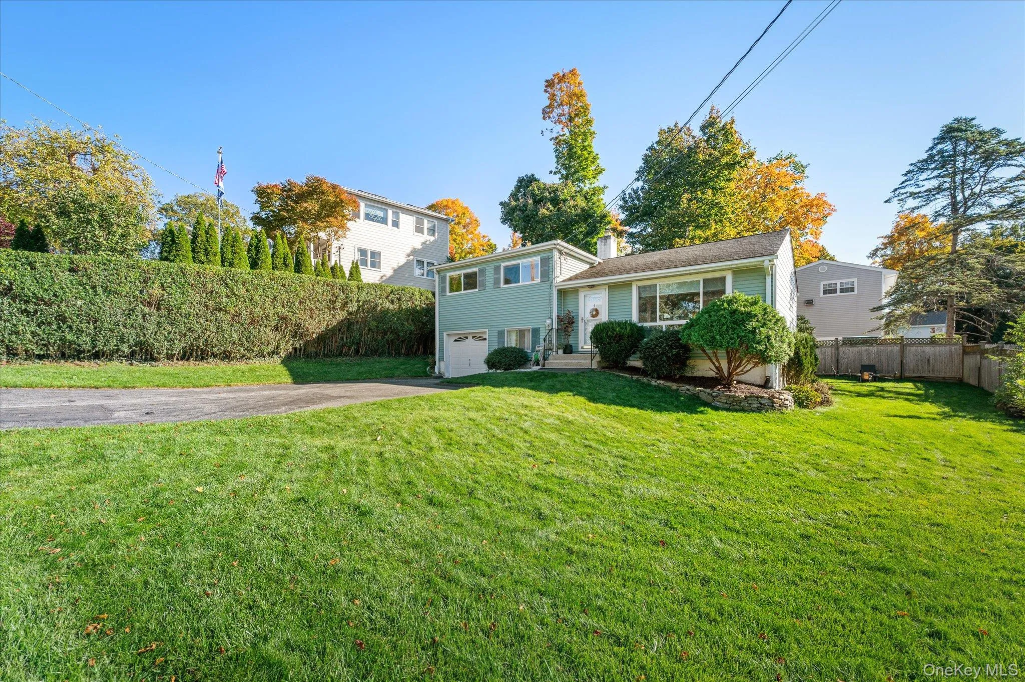 A gracious front lawn to greet the neighbors from. A gracious front lawn to greet the neighbors from.