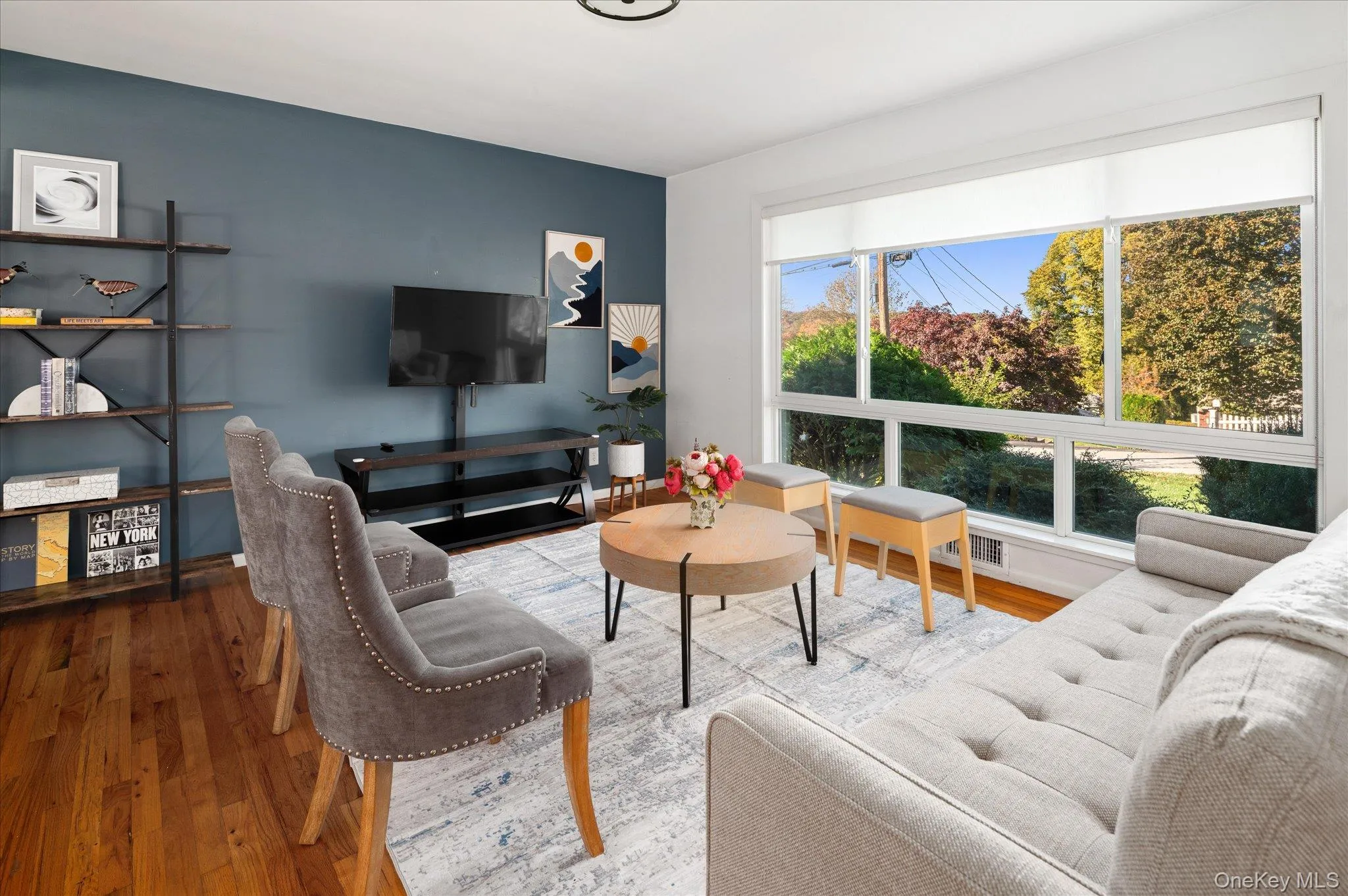 Large custom picture window overlooks the quiet street. Large custom picture window overlooks the quiet street.