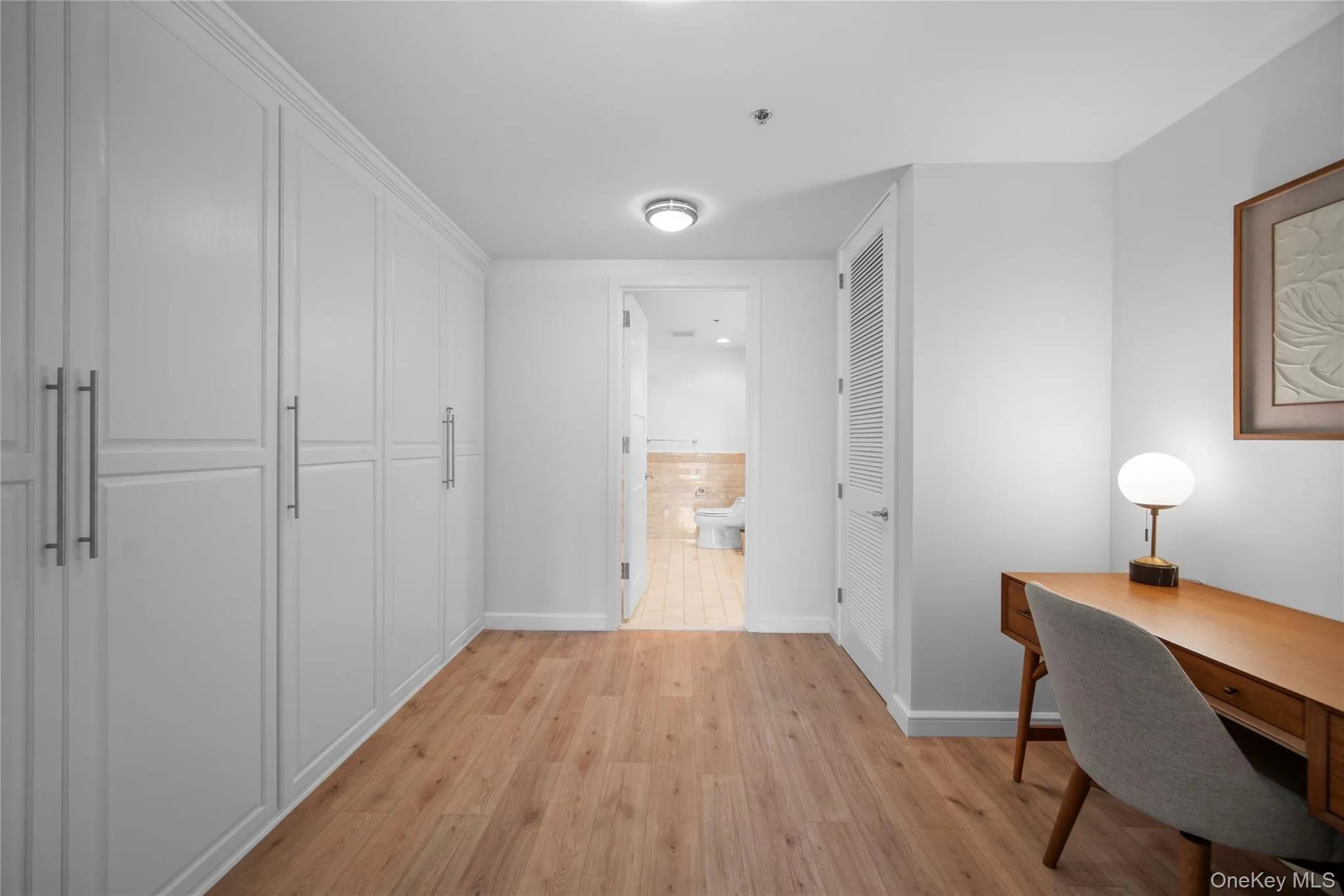 Office with light wood-style flooring and baseboards Office with light wood-style flooring and baseboards