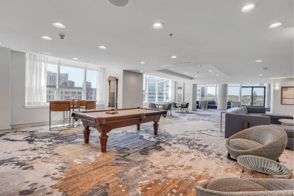 Rec room featuring billiards, recessed lighting, and baseboards Rec room featuring billiards, recessed lighting, and baseboards