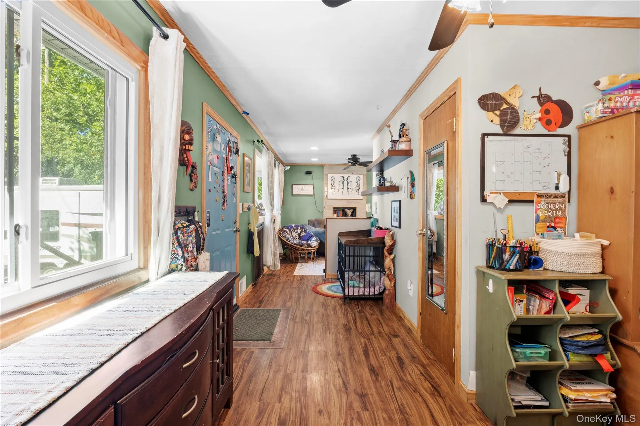 Wood-finish flooring, large windows with natural light, recessed ceiling lighting, and wood-trim door frames Wood-finish flooring, large windows with natural light, recessed ceiling lighting, and wood-trim door frames