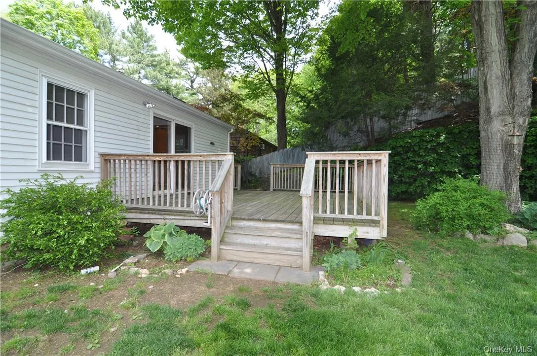 View of yard featuring a wooden deck View of yard featuring a wooden deck