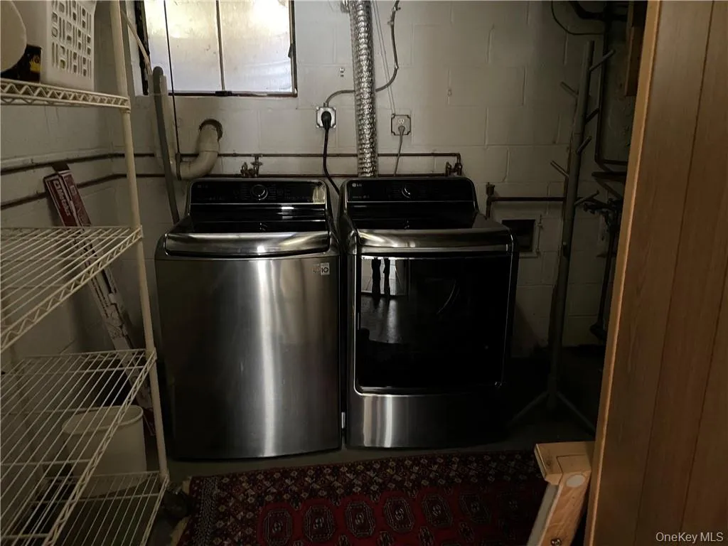 Clothes washing area with washing machine and dryer Clothes washing area with washing machine and dryer