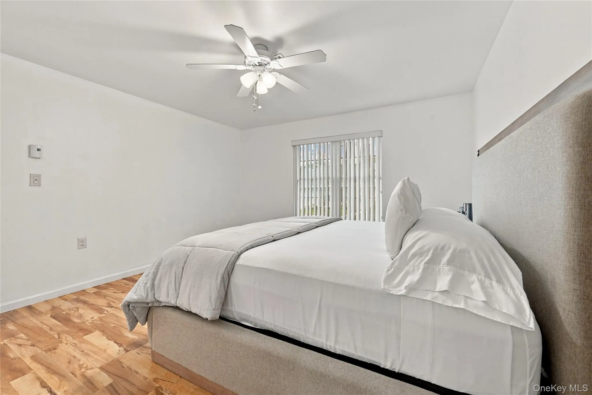 The Light & Bright, Comfortable & Inviting Large Primary Bedroom Offers Modern Decor & Hues, Ample Room For A Large Bedroom Set/Furniture, A Double Vinyl Insulated Replacement Window For Natural Light, Ceiling Fan, Laminate Flooring, A Large Walk In Closet & Access To The Private/Primary Bathroom. The Light & Bright, Comfortable & Inviting Large Primary Bedroom Offers Modern Decor & Hues, Ample Room For A Large Bedroom Set/Furniture, A Double Vinyl Insulated Replacement Window For Natural Light, Ceiling Fan, Laminate Flooring, A Large Walk In Closet & Access To The Private/Primary Bathroom.