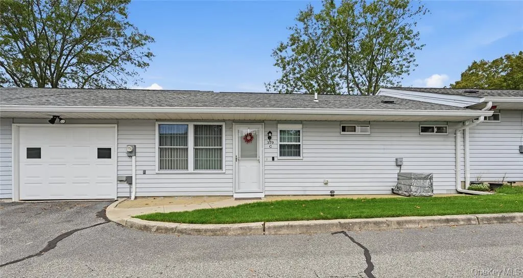 The Back Of The Home Offers A Doorway Into The Kitchen, Access To The Driveway & To The Attached Garage. The Back Of The Home Offers A Doorway Into The Kitchen, Access To The Driveway & To The Attached Garage.