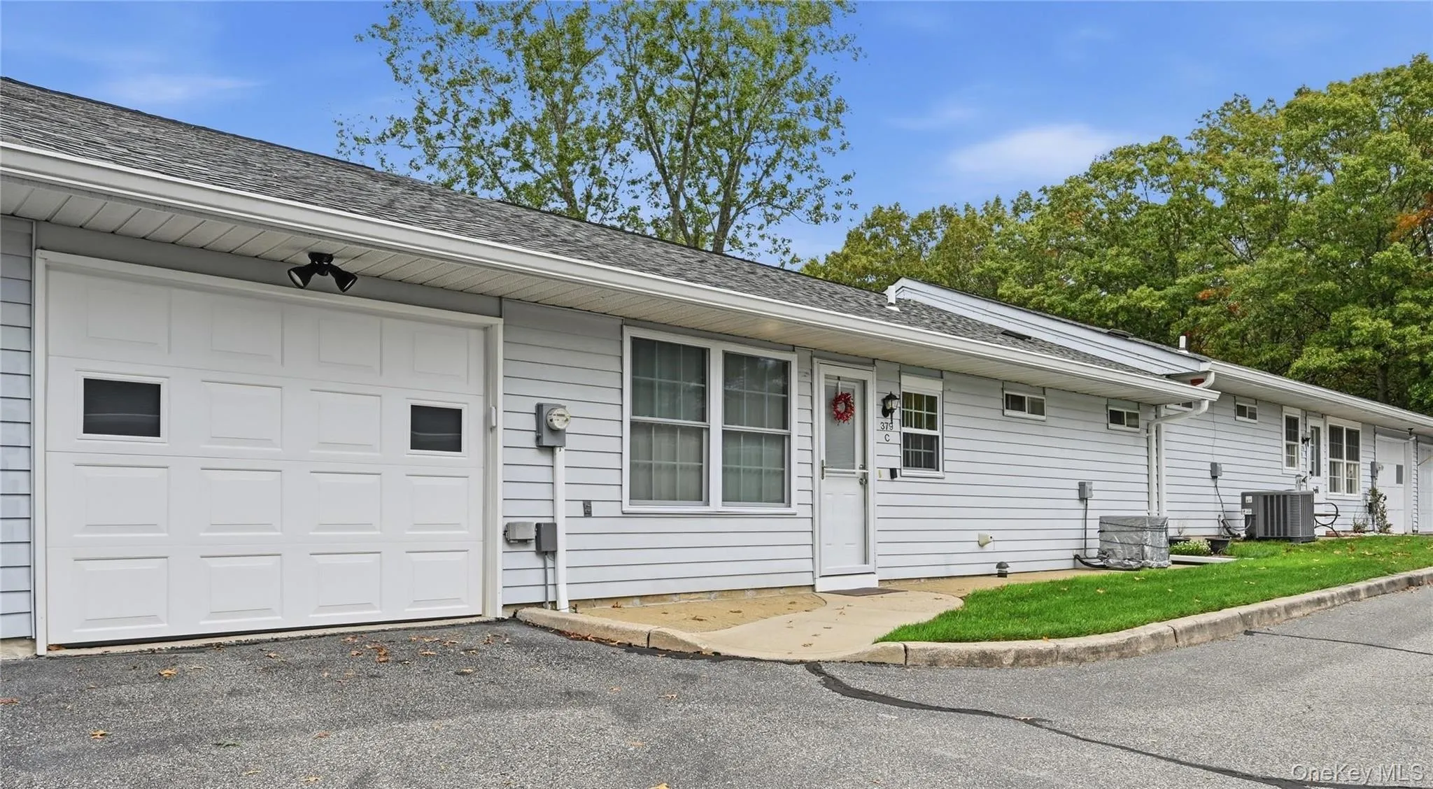 The Back Of The Home Offers A Doorway Into The Kitchen, Access To The Driveway & To The Attached Garage. The Back Of The Home Offers A Doorway Into The Kitchen, Access To The Driveway & To The Attached Garage.