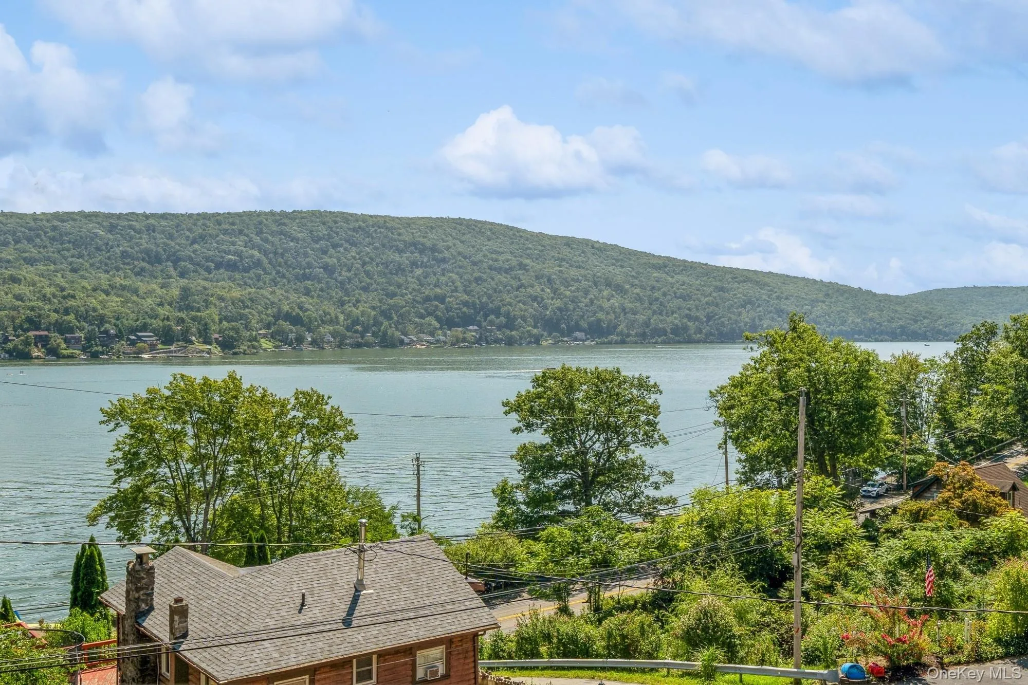 View of water feature featuring a mountain view and a wooded view View of water feature featuring a mountain view and a wooded view