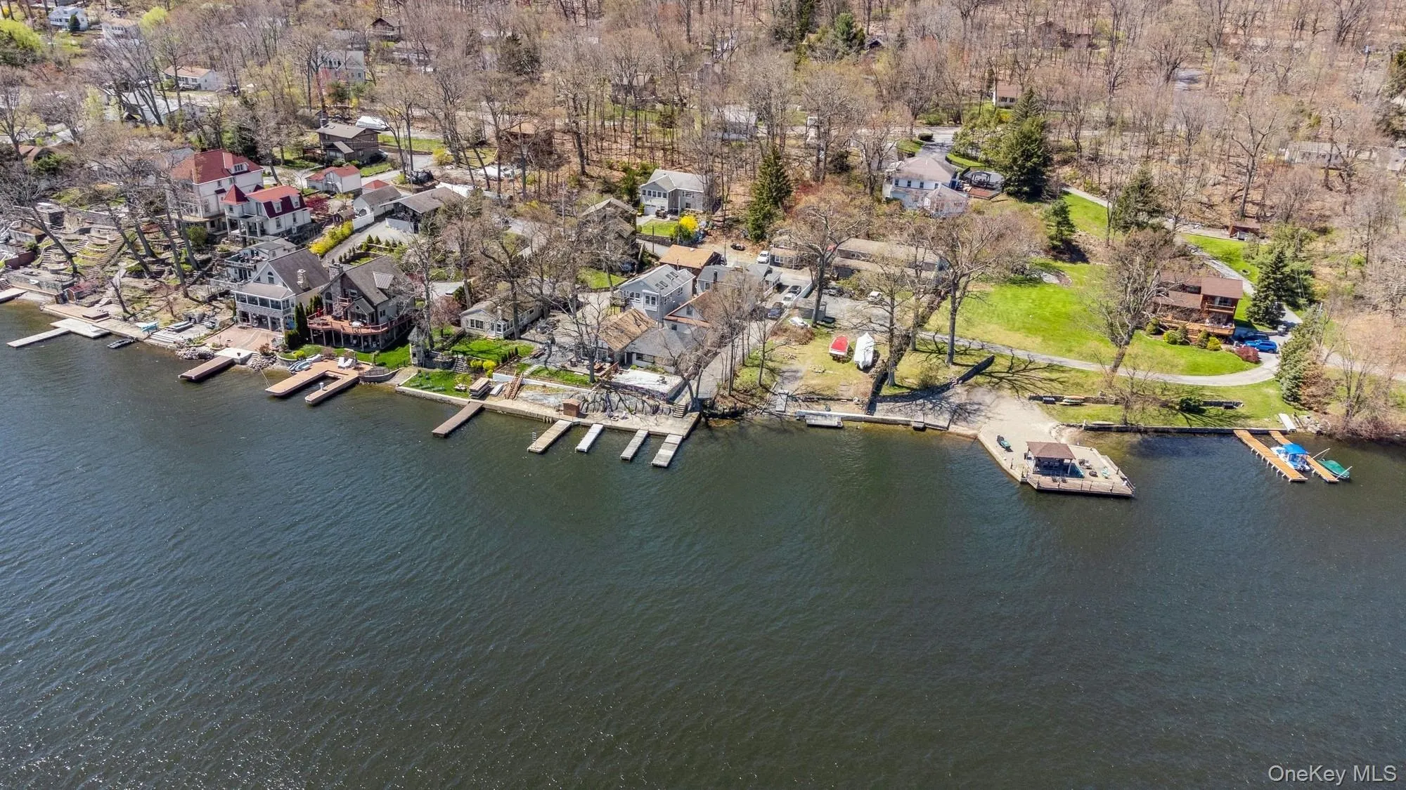 Drone / aerial view featuring a residential view and a water view Drone / aerial view featuring a residential view and a water view
