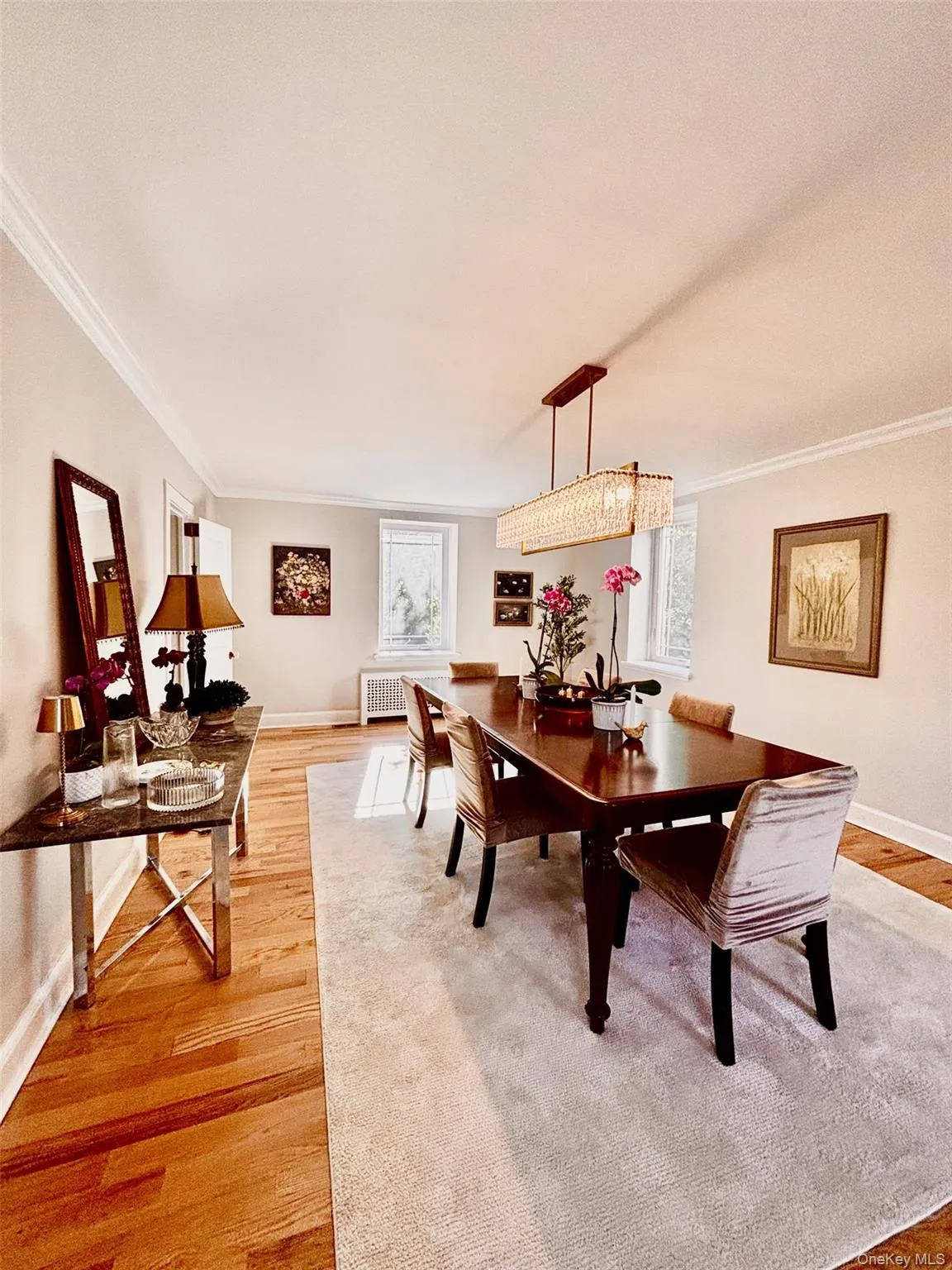 Dining area featuring, crown molding, and a crystal chandelier Dining area featuring, crown molding, and a crystal chandelier