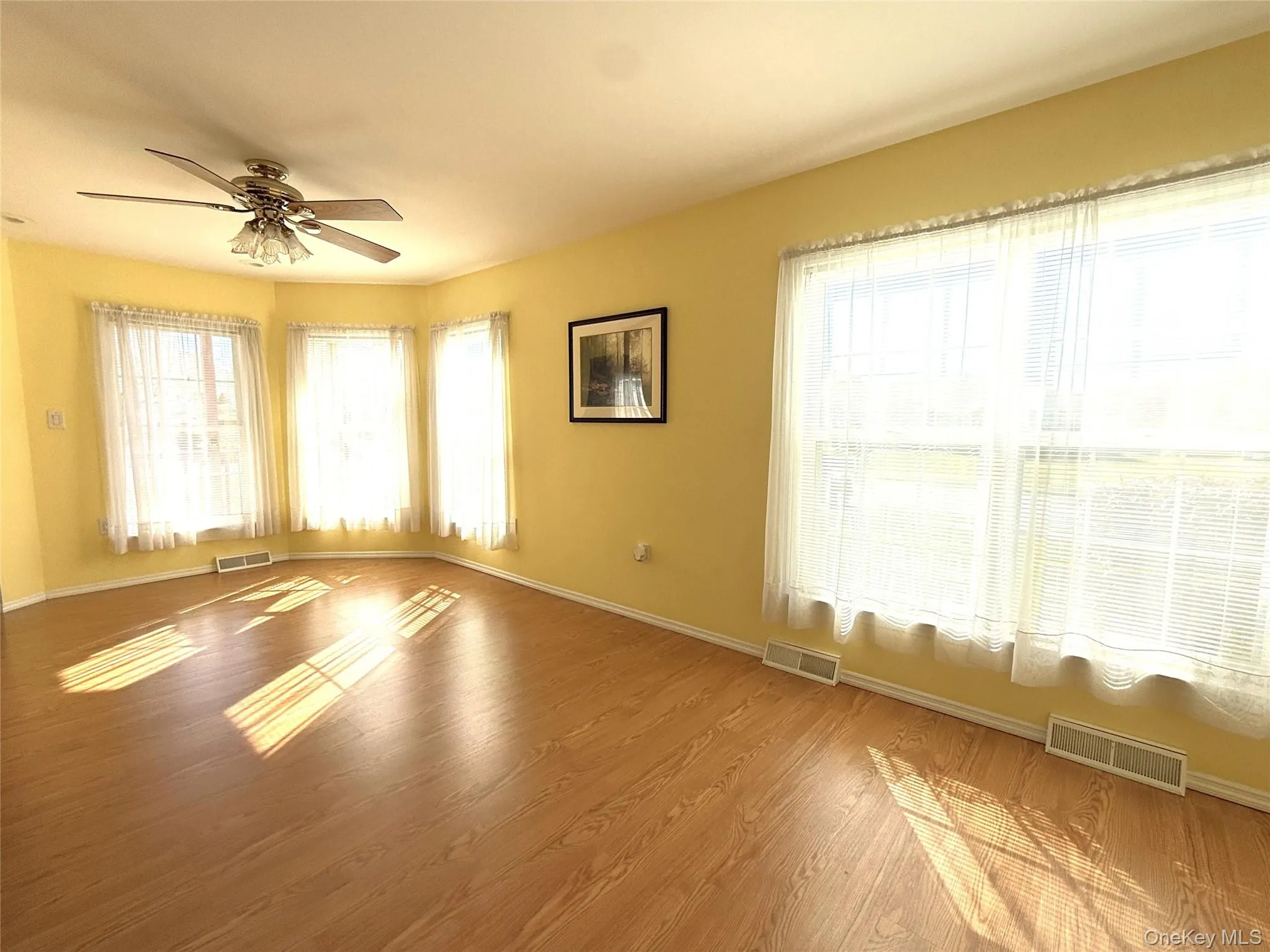 Bright Dining Room with well-kept floors. Bright Dining Room with well-kept floors.