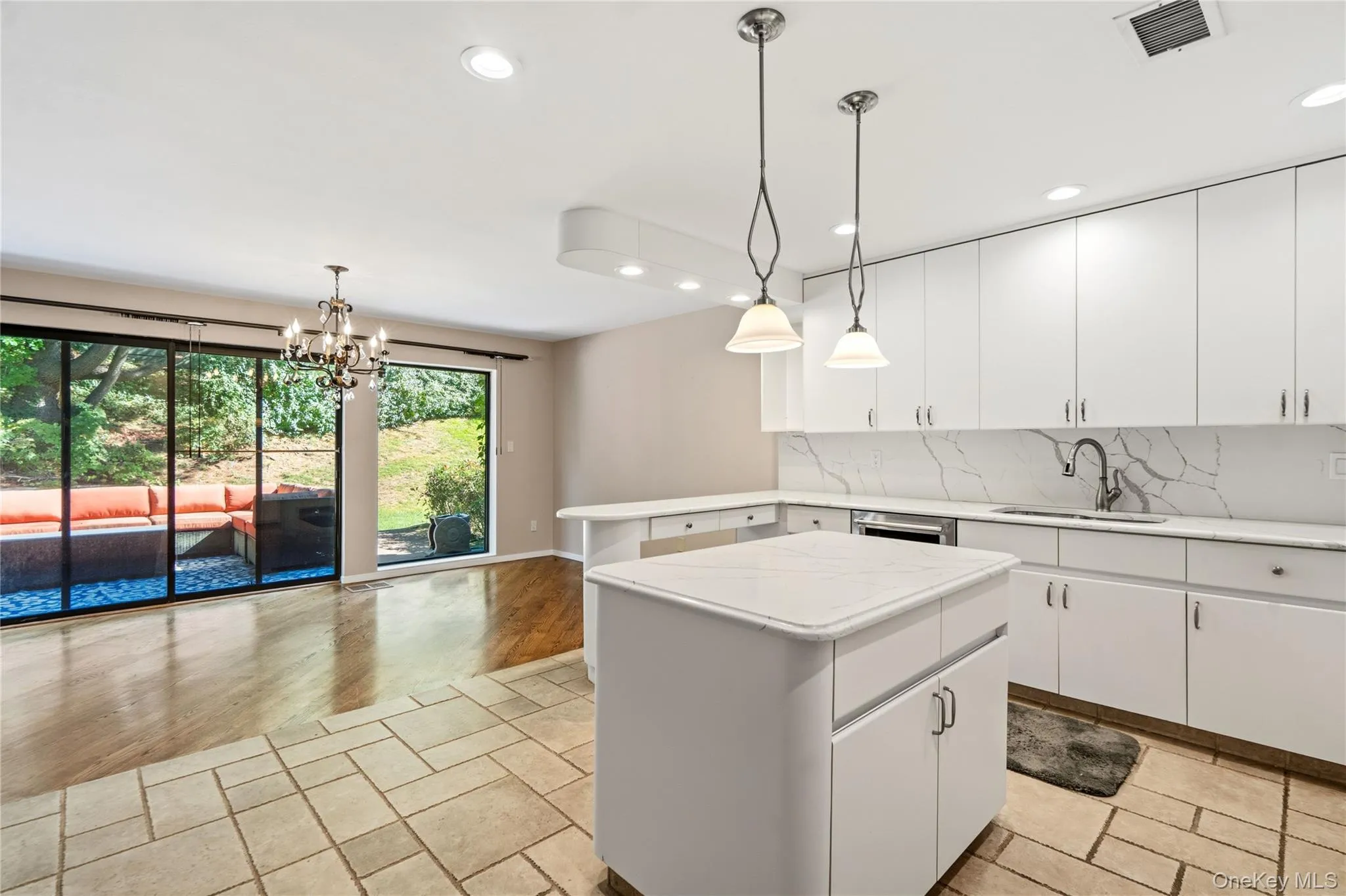 Kitchen with view to Dining Room and Backyard Kitchen with view to Dining Room and Backyard