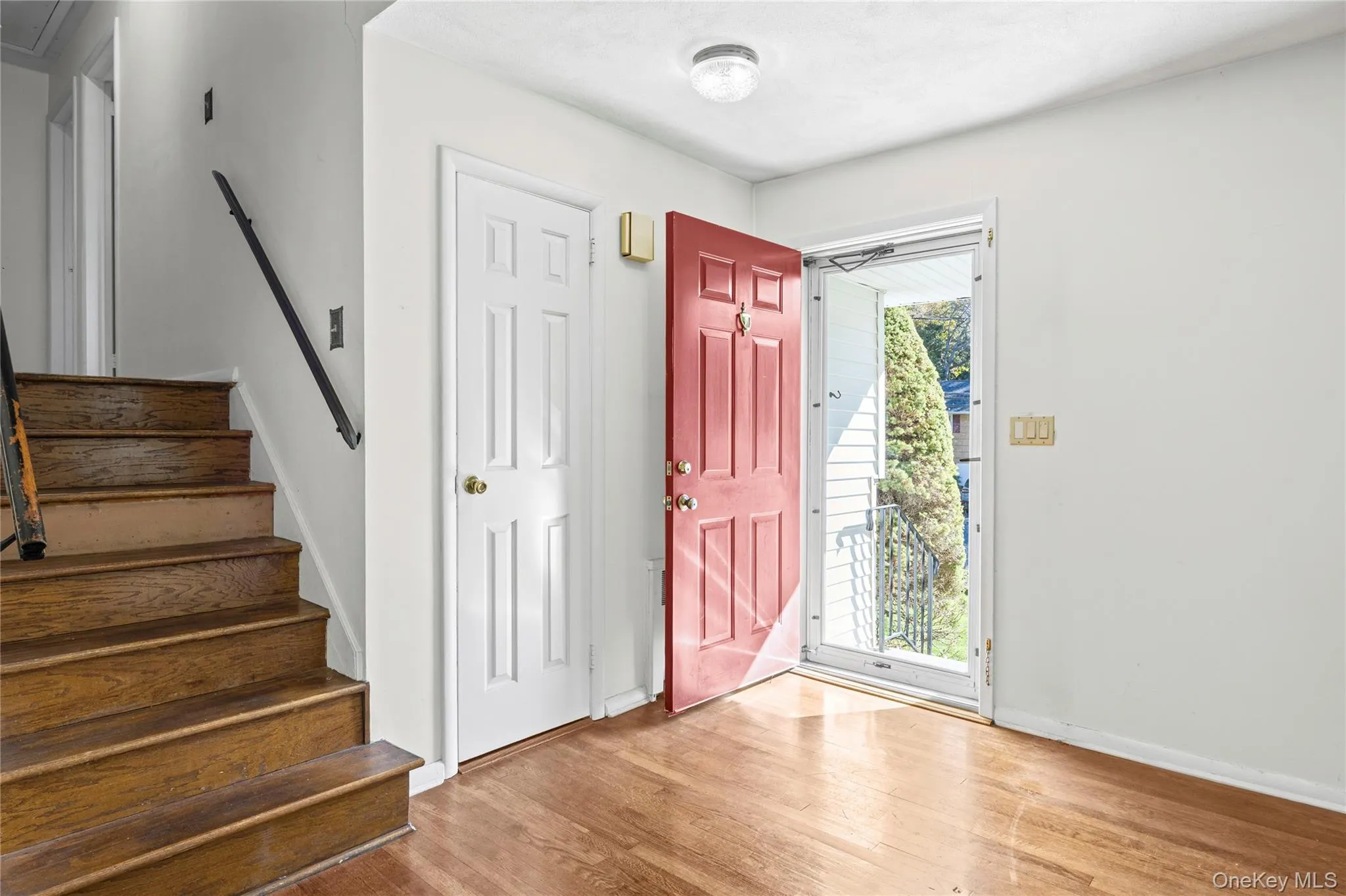 Entrance Foyer opens to Living Room- stairs to 2nd Level Entrance Foyer opens to Living Room- stairs to 2nd Level
