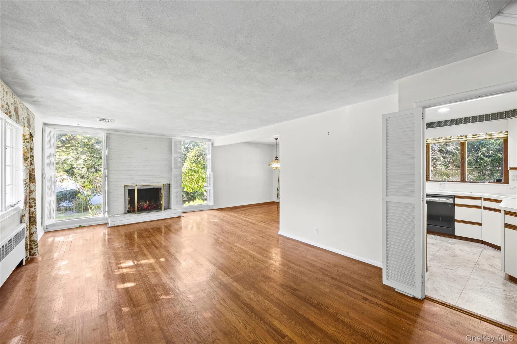 Light Bright Inviting Living Room opens to Dining Room- Lovely flow for entertaining! Light Bright Inviting Living Room opens to Dining Room- Lovely flow for entertaining!