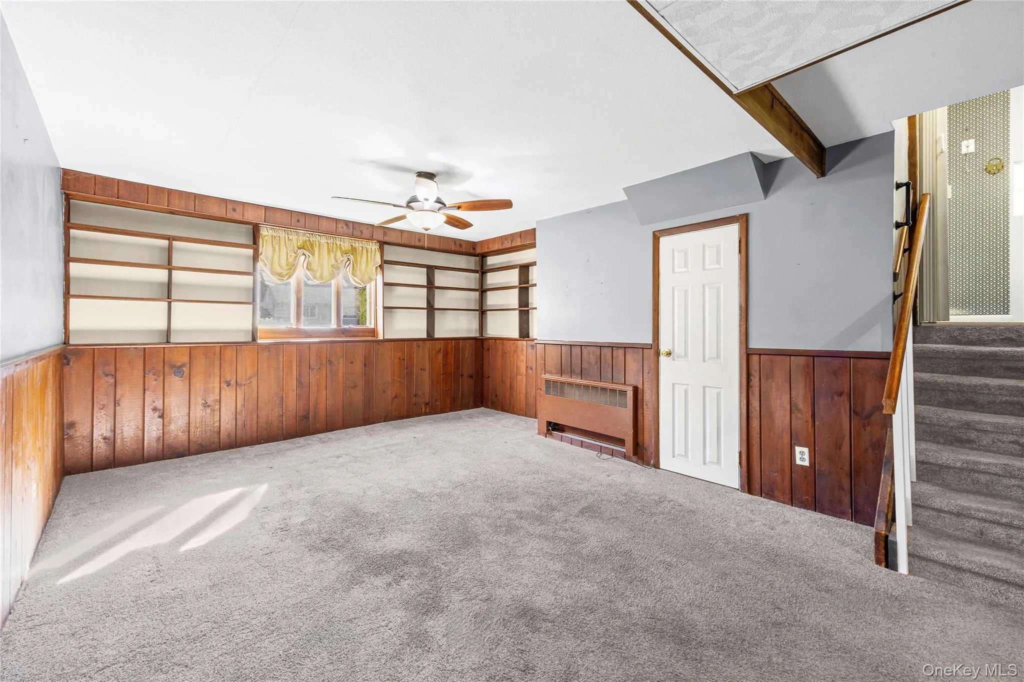 LOWER LEVEL -Den w/Built Ins, Garage Entry. LOWER LEVEL -Den w/Built Ins, Garage Entry.