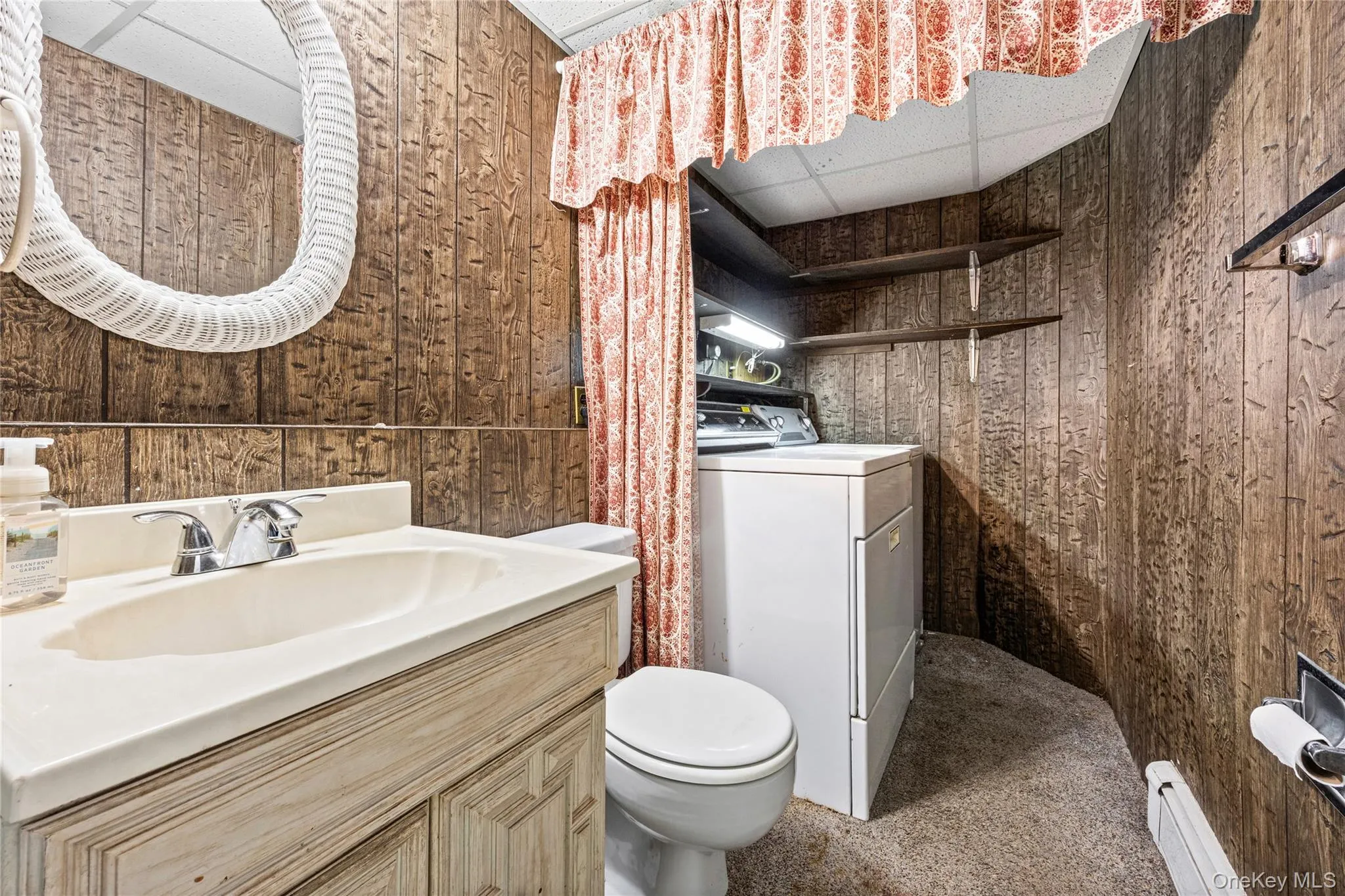 LOWER LEVEL- Half Bath/Laundry LOWER LEVEL- Half Bath/Laundry