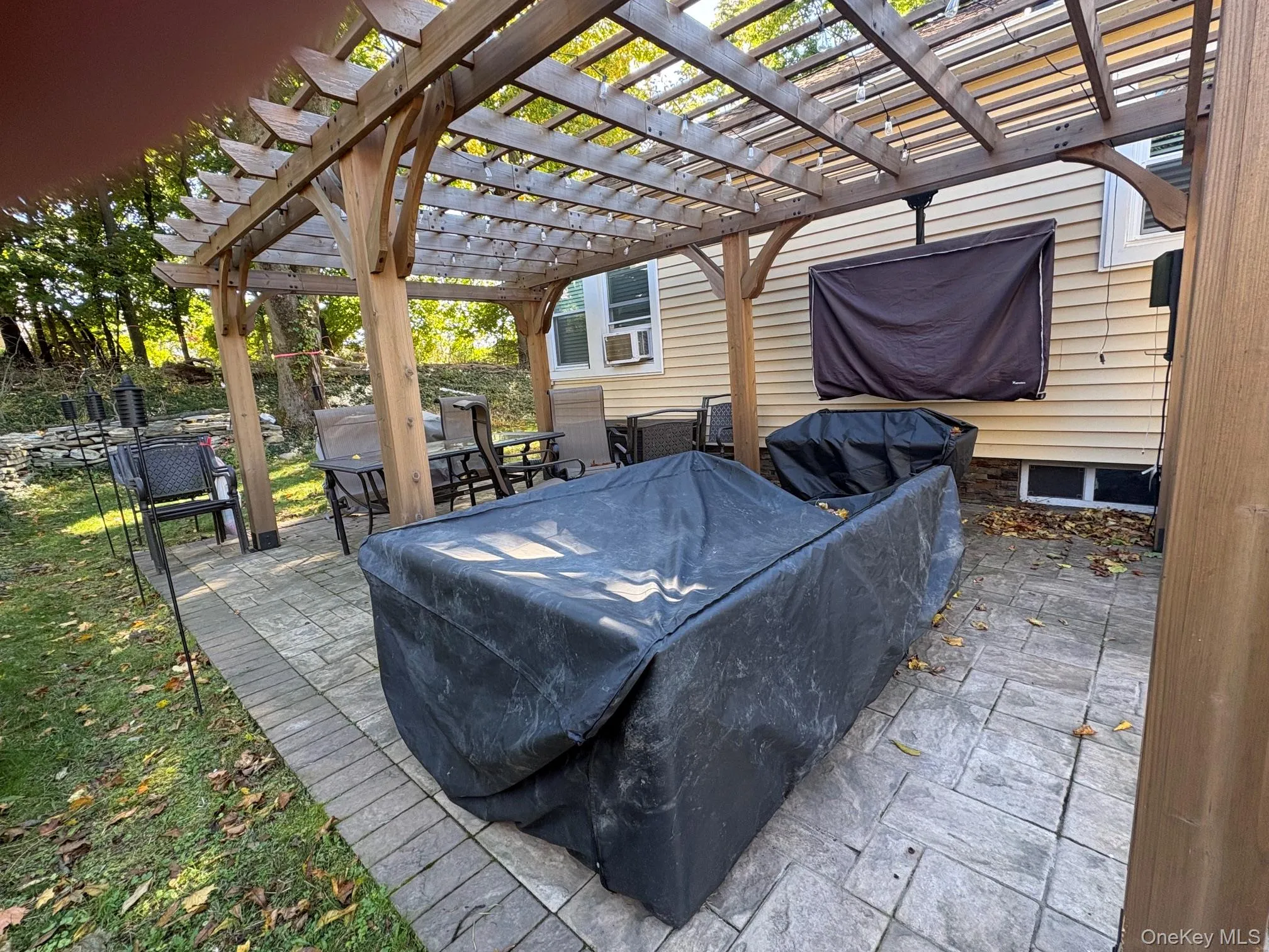 Patio area in backyard Patio area in backyard