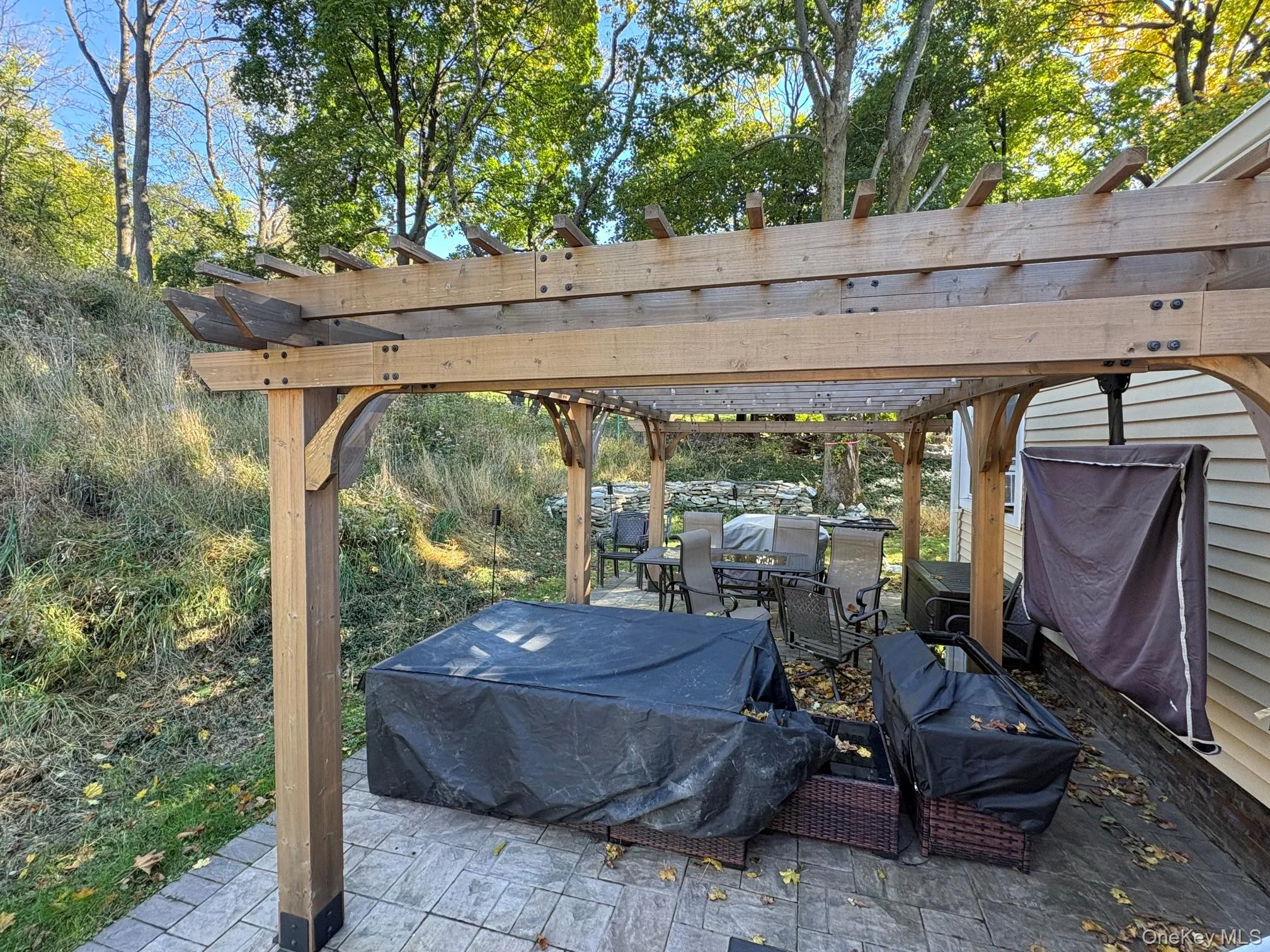 Pergola and patio area in backyard Pergola and patio area in backyard