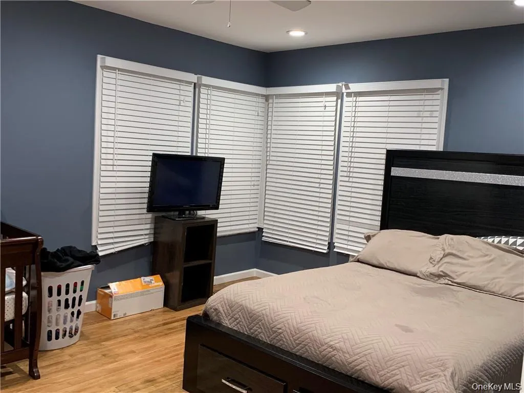 Primary bedroom has so much natural light with 4 windows Primary bedroom has so much natural light with 4 windows