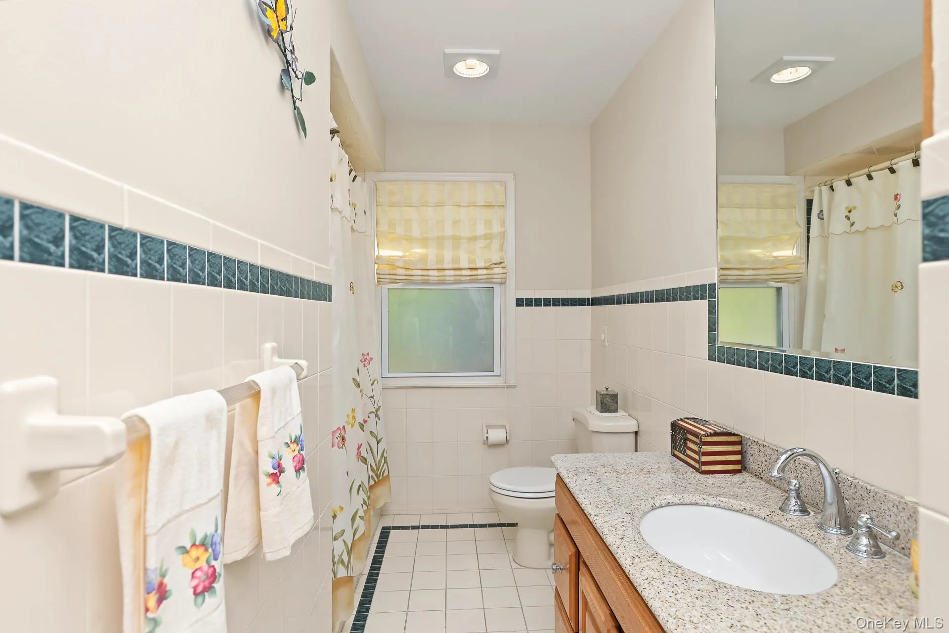 Wood Vanity, Bathtub w Shower, Tiled Floor Wood Vanity, Bathtub w Shower, Tiled Floor