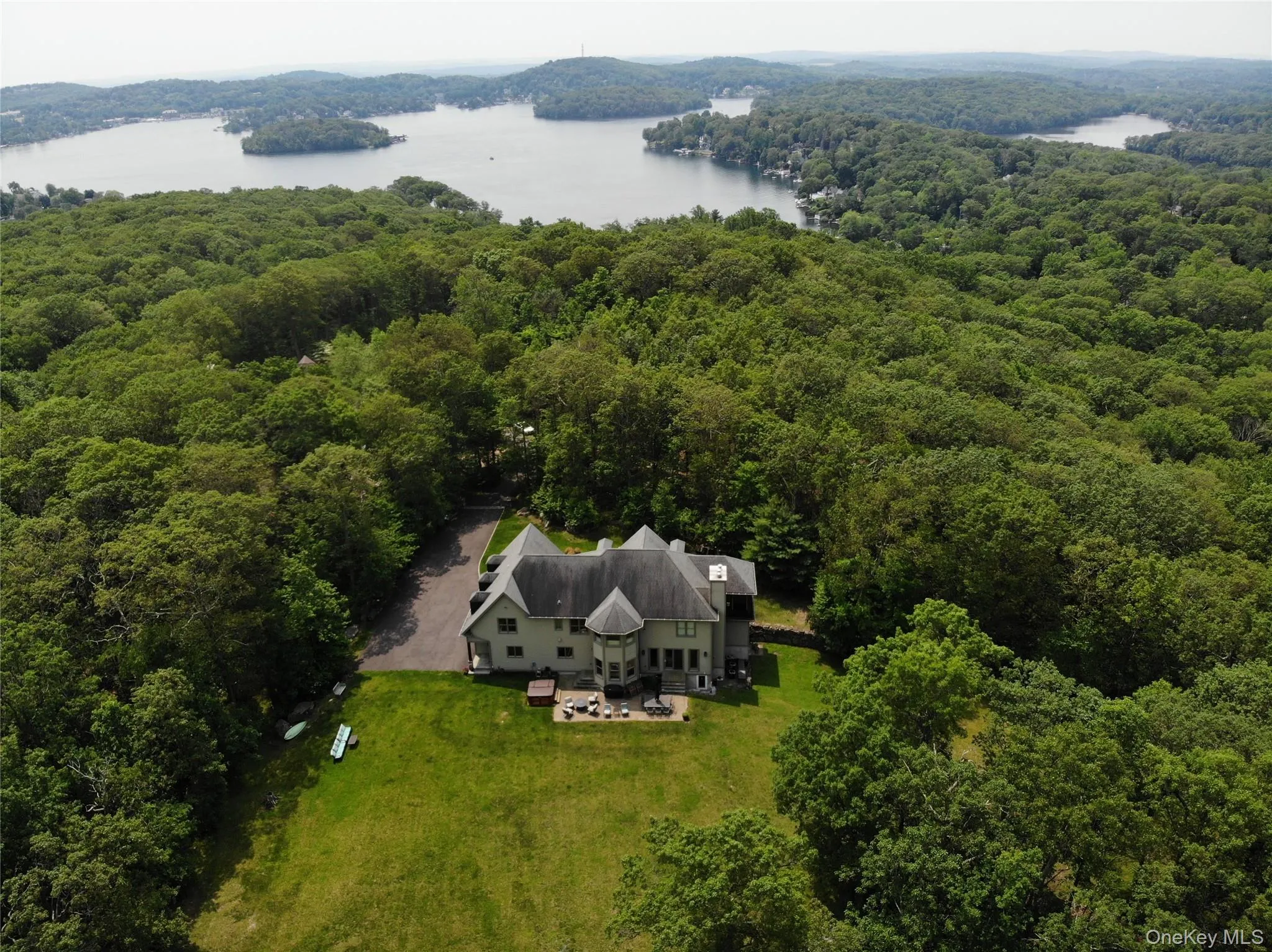 Aerial view of the property with a heavily wooded area and nearby "LAKE MAHOPAC" Aerial view of the property with a heavily wooded area and nearby "LAKE MAHOPAC"