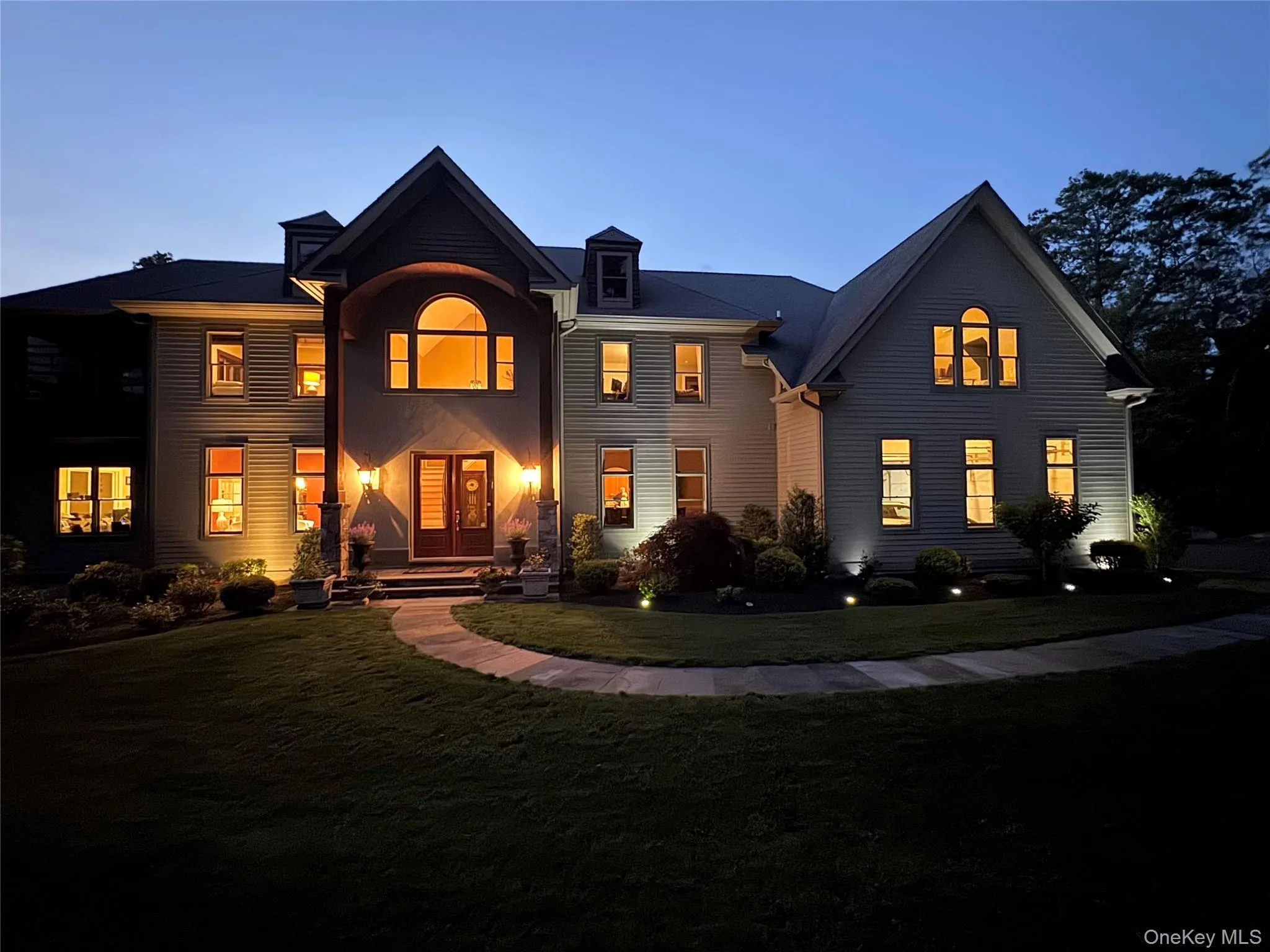 View of front of property featuring a nighttime view View of front of property featuring a nighttime view
