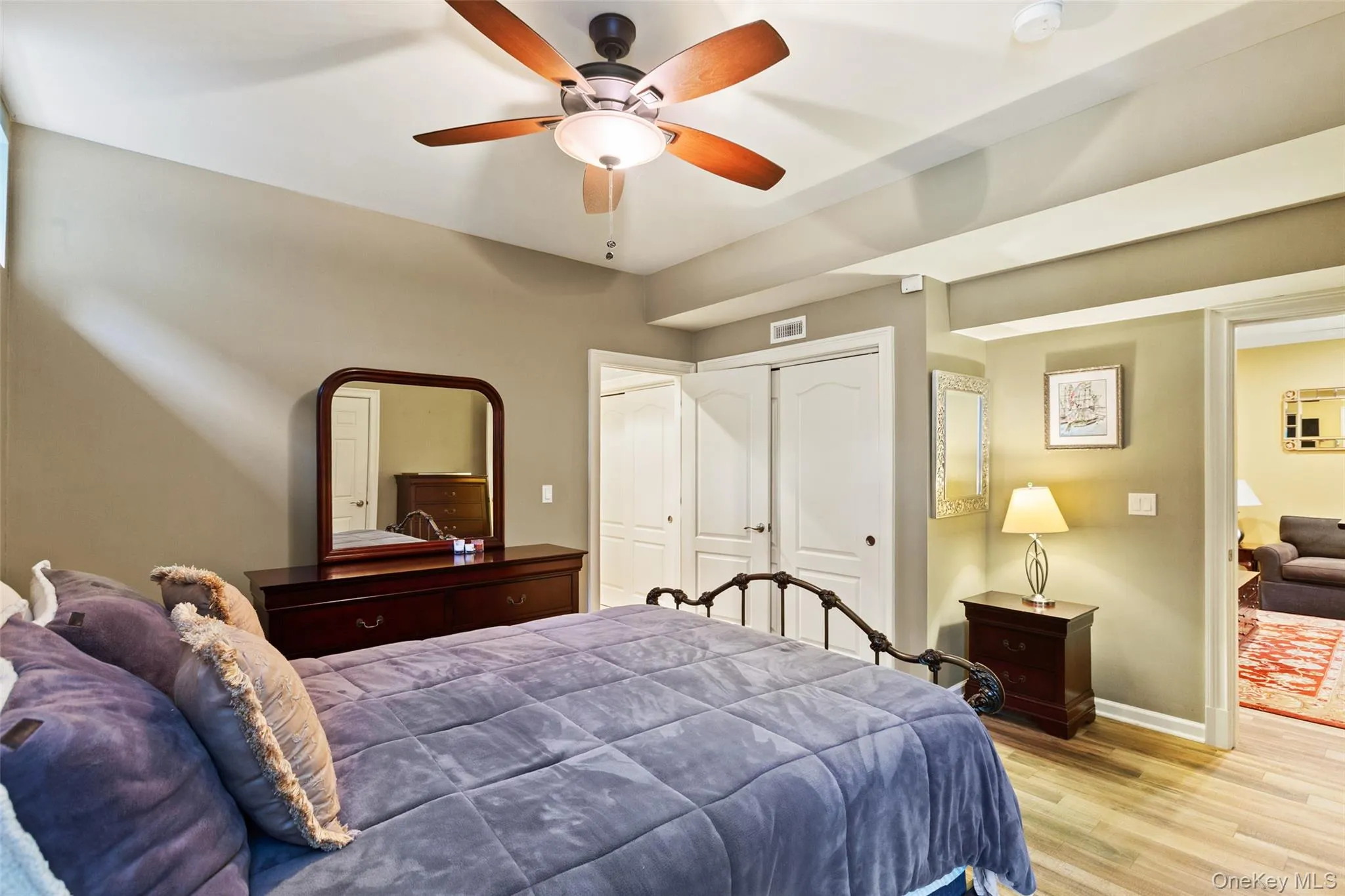 Bedroom featuring light wood-style flooring, baseboards, a closet, and ceiling fan Bedroom featuring light wood-style flooring, baseboards, a closet, and ceiling fan