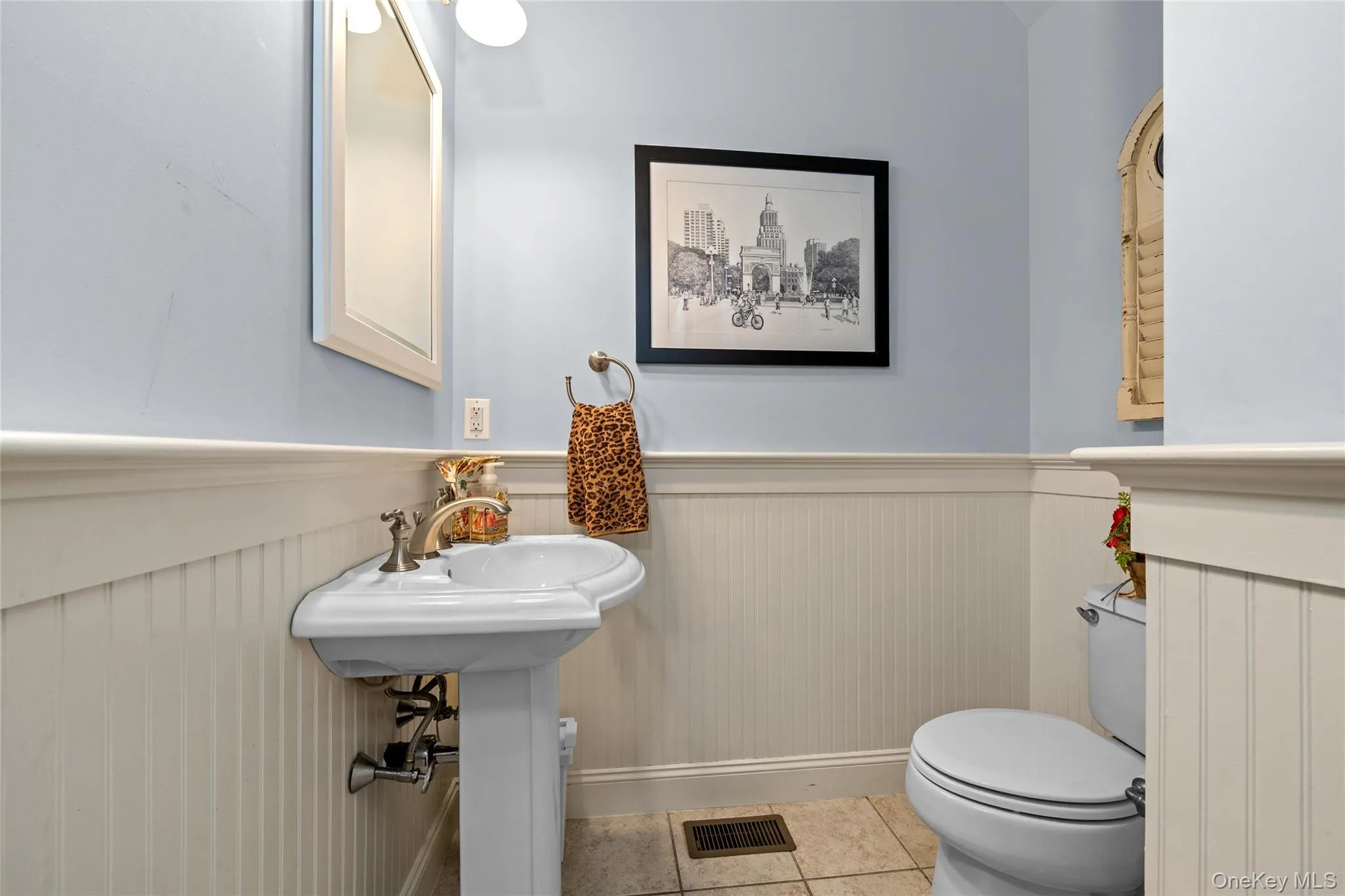 The wainscoting and detailing set this half bath apart. The wainscoting and detailing set this half bath apart.