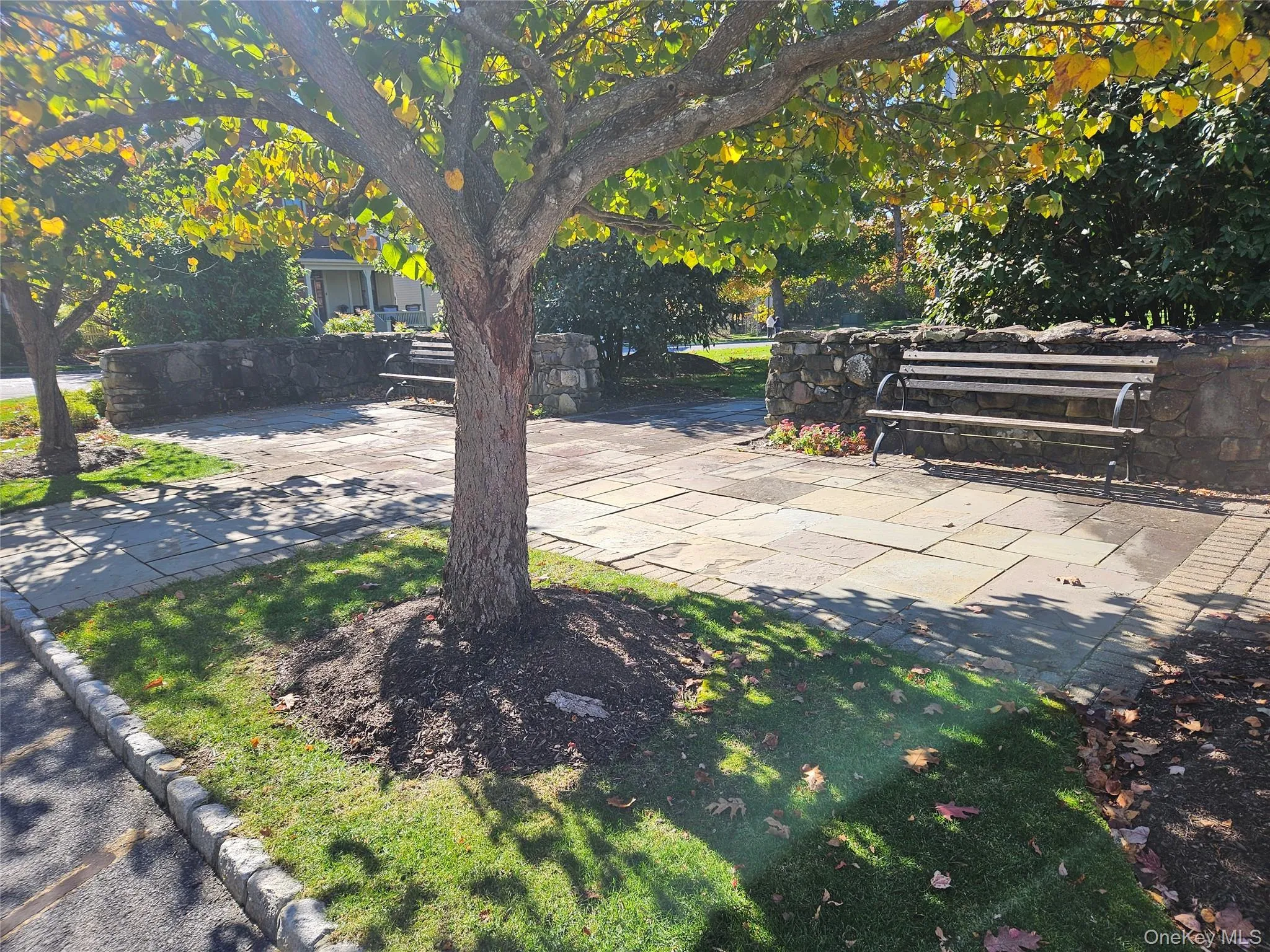 A place to sit, adjoining a green across from both the Community Center and Postal Center. A place to sit, adjoining a green across from both the Community Center and Postal Center.