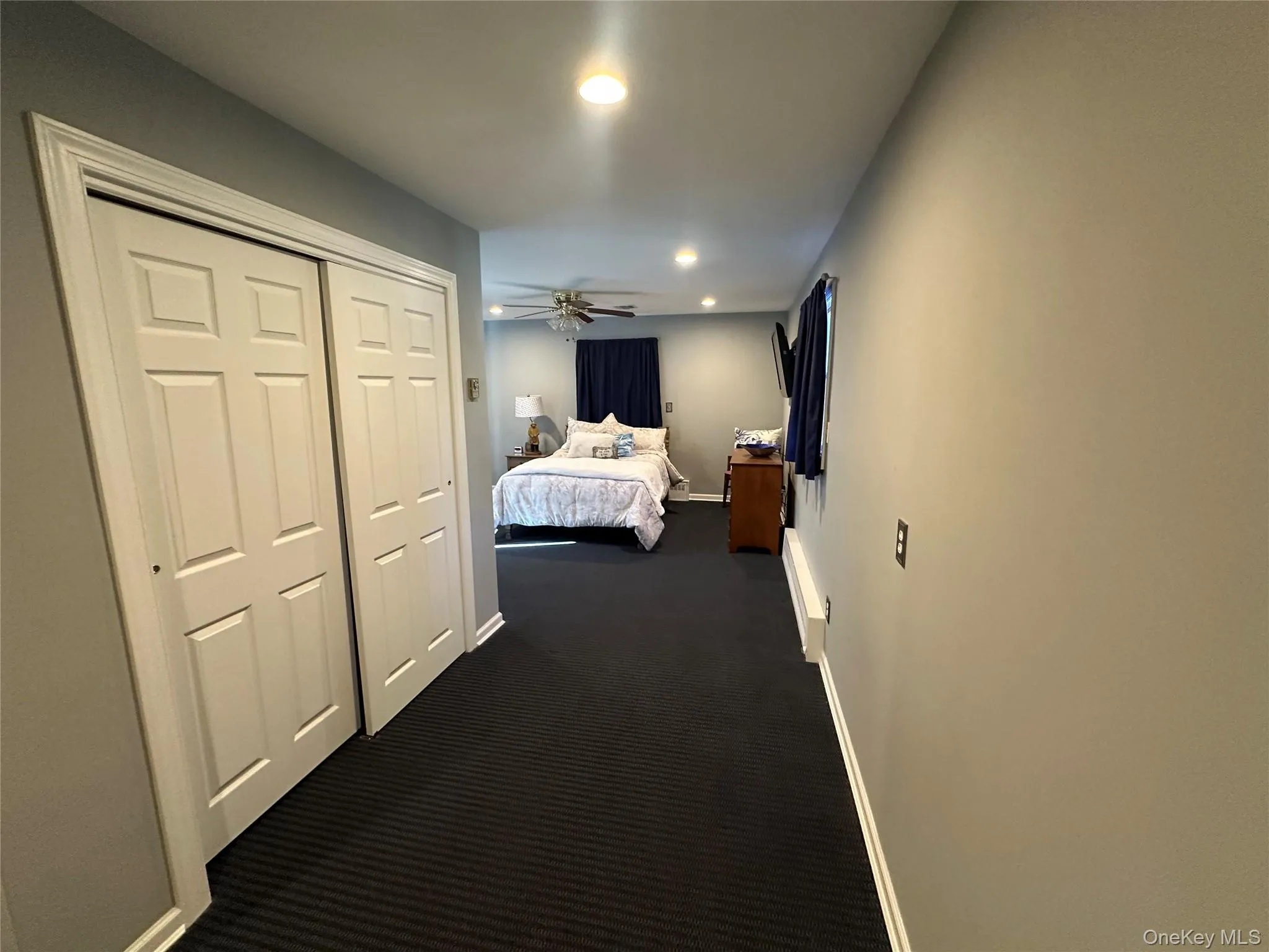 Room featuring wall-to-wall carpeting, recessed lighting, and a ceiling fan with integrated light fixture Room featuring wall-to-wall carpeting, recessed lighting, and a ceiling fan with integrated light fixture