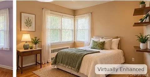 Hardwood flooring, double-hung windows, and wood-finish floating shelving Hardwood flooring, double-hung windows, and wood-finish floating shelving