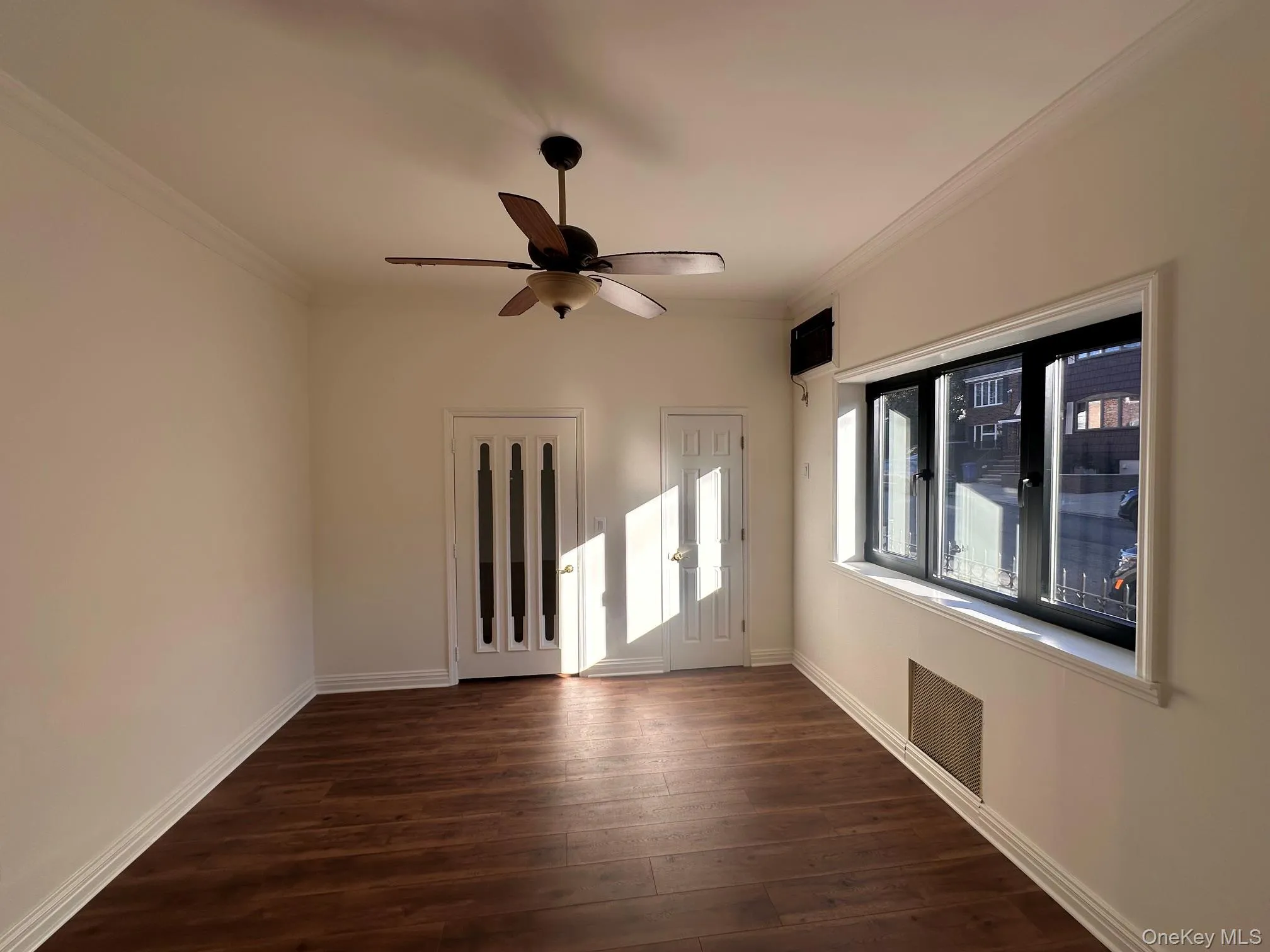 Master bedroom with a big window Master bedroom with a big window