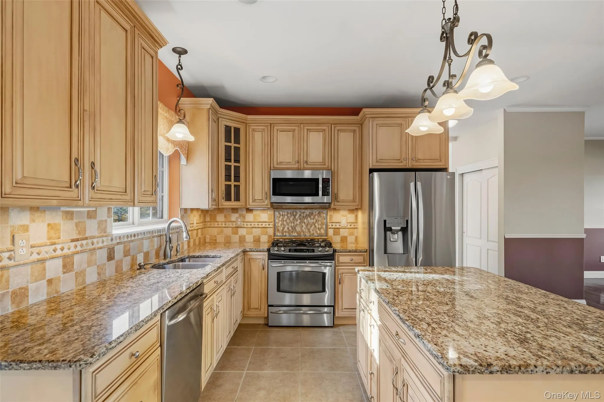 Granite counters and island, stainless steel appliances, pantry, ceramic tile floor Granite counters and island, stainless steel appliances, pantry, ceramic tile floor