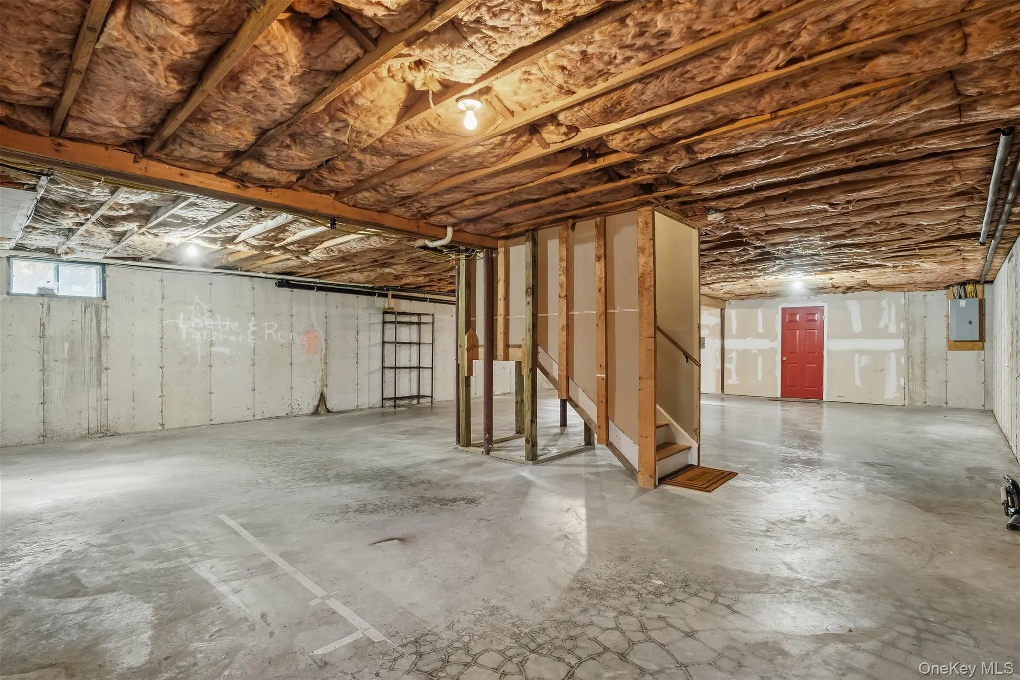 Unfinished basement with immense storage space, exits to garage Unfinished basement with immense storage space, exits to garage