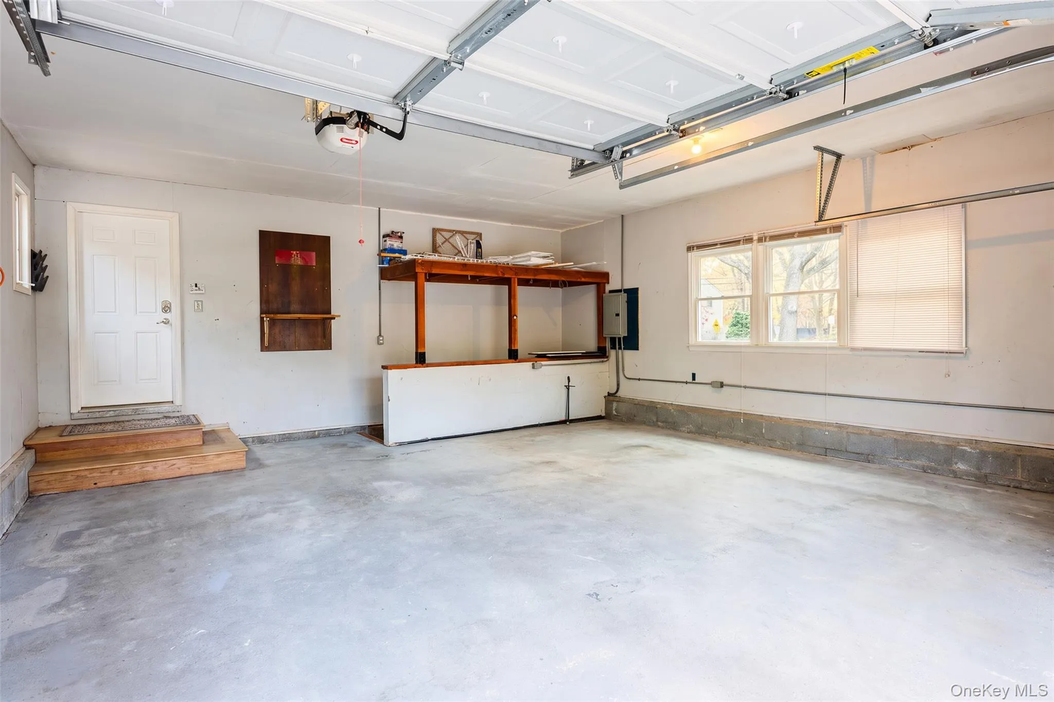 2 Car Garage, entrance to full partially finished basement. 2 Car Garage, entrance to full partially finished basement.