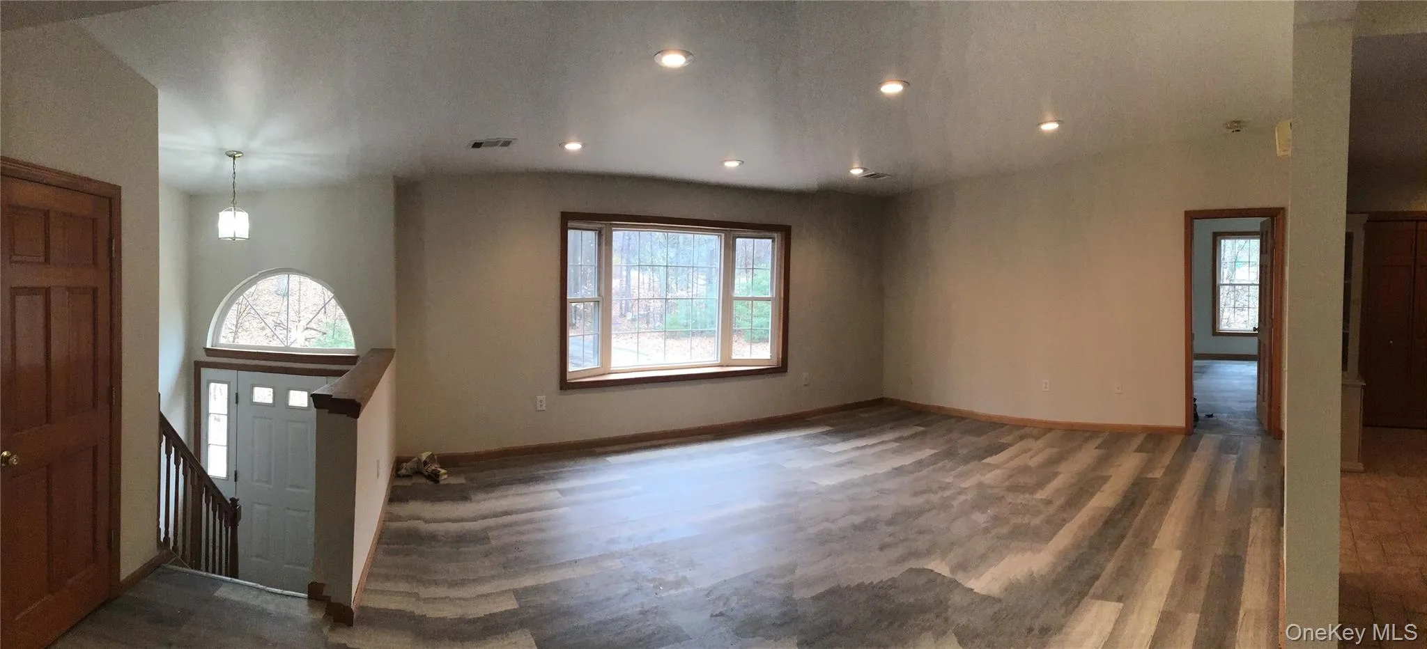 Foyer entrance featuring dark wood-style floors and recessed lighting Foyer entrance featuring dark wood-style floors and recessed lighting
