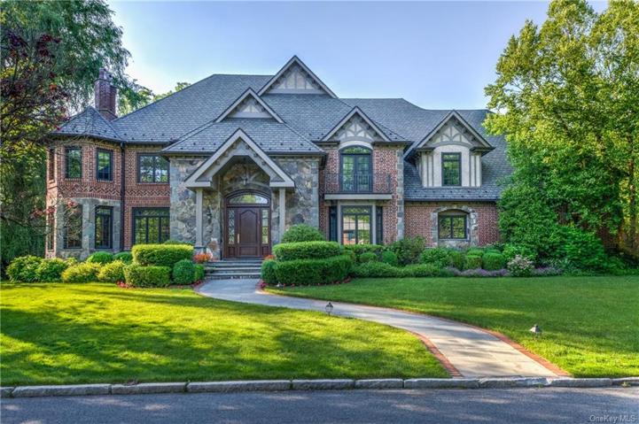 Award-winning custom-built brick and stone Tudor.