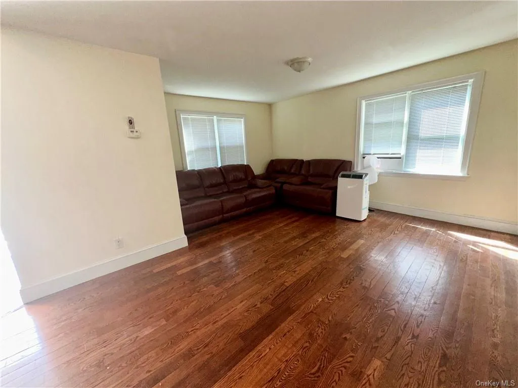 1st Floor - Unfurnished living room with dark hardwood / wood-style flooring 1st Floor - Unfurnished living room with dark hardwood / wood-style flooring