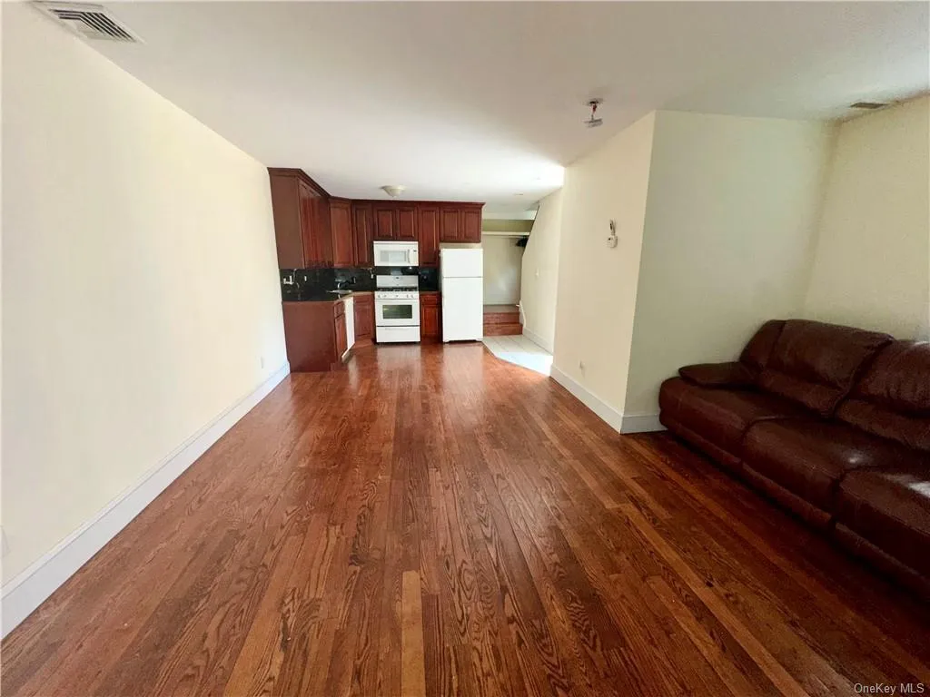 1st Floor - Unfurnished living room with dark hardwood / wood-style floors 1st Floor - Unfurnished living room with dark hardwood / wood-style floors