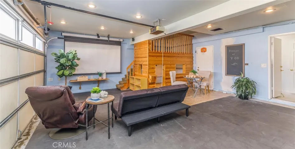 Your kids will love this Built in Playhouse and Home Theatre with 8 foot dropdown screen and surround sound.