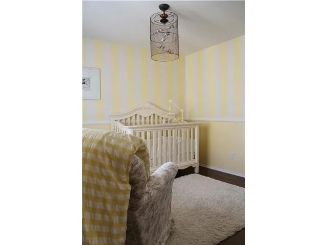Little details are found throughout this home that make it special, such as the base board & chair rail in this room
