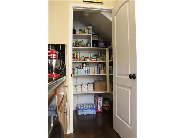 A full walk-in pantry keeps everything handy & organized