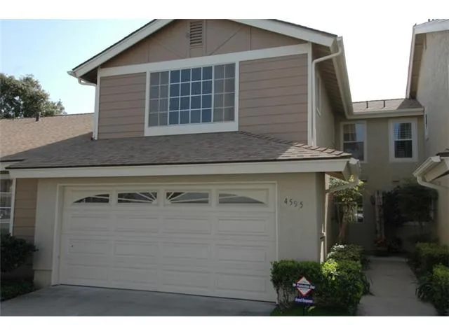 This fully remodeled home has it all.  Location... three spacious bedrooms... two and one half baths... attached two car garage... and even it's own security system.  Click on photo for a larger image.