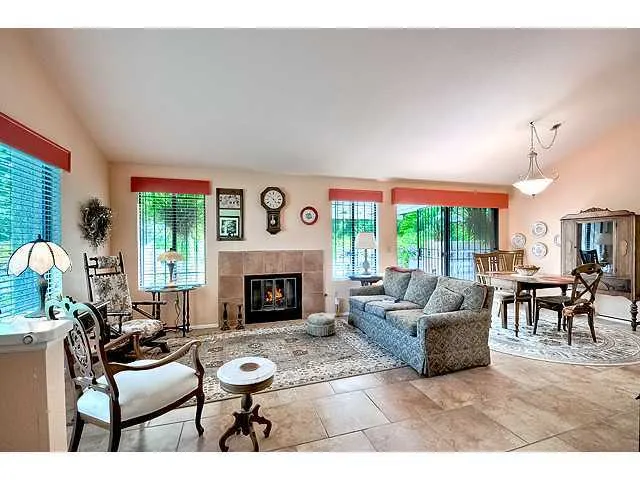 Living room/Dining room with cozy fireplace.